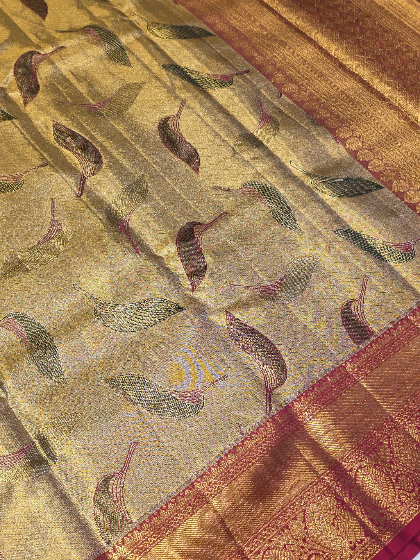 Handloom pure kanchee tissue silk with leaf motif and traditional border , rich pallu wedding wear