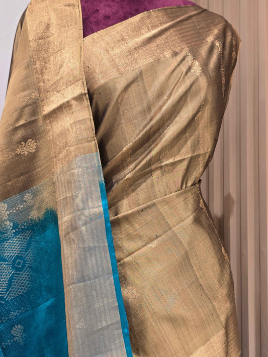 traditional Indian handloom saree crafted from a luminous, dual-tone fabric like tissue soft silk