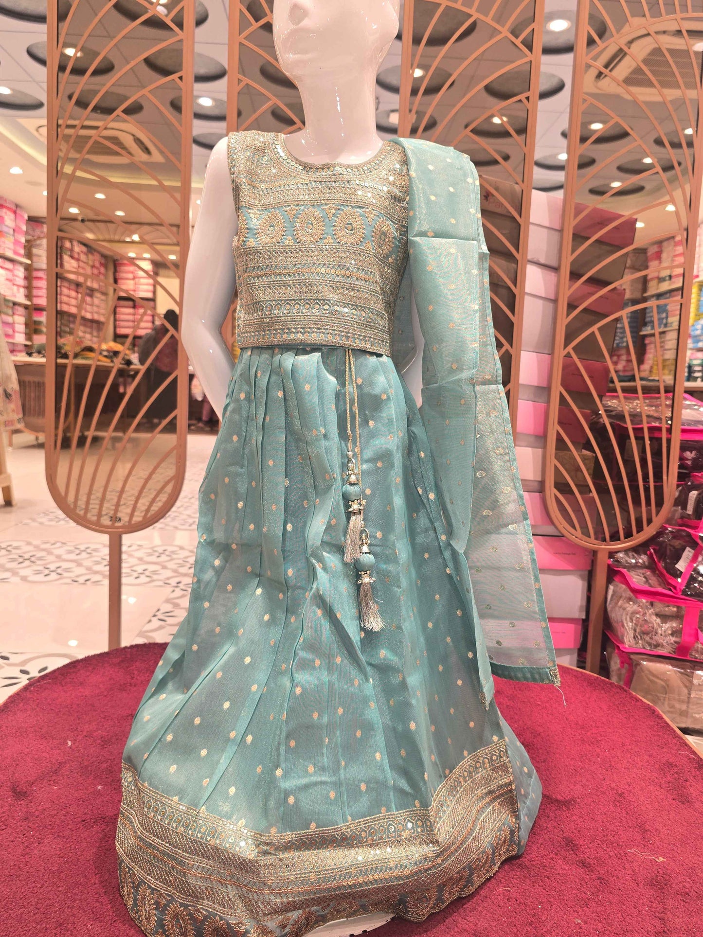 Organza material radium green colour ethnic wear gaghra choli with zari work and top & border. Small butta over the body