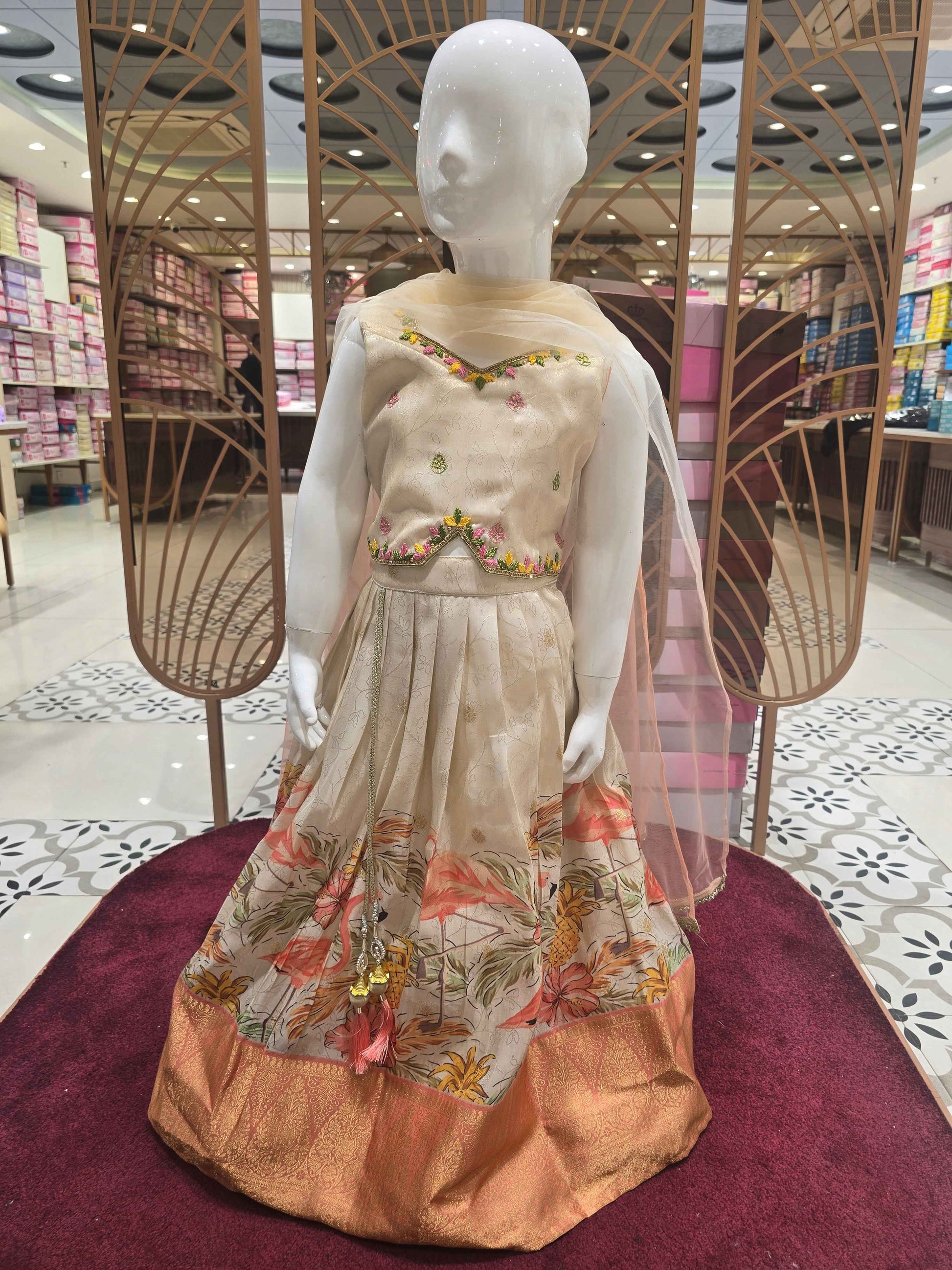 Tissue silk material cream colour ethnic wear with floral prints for garghra and long traditional border. star neck had thread work