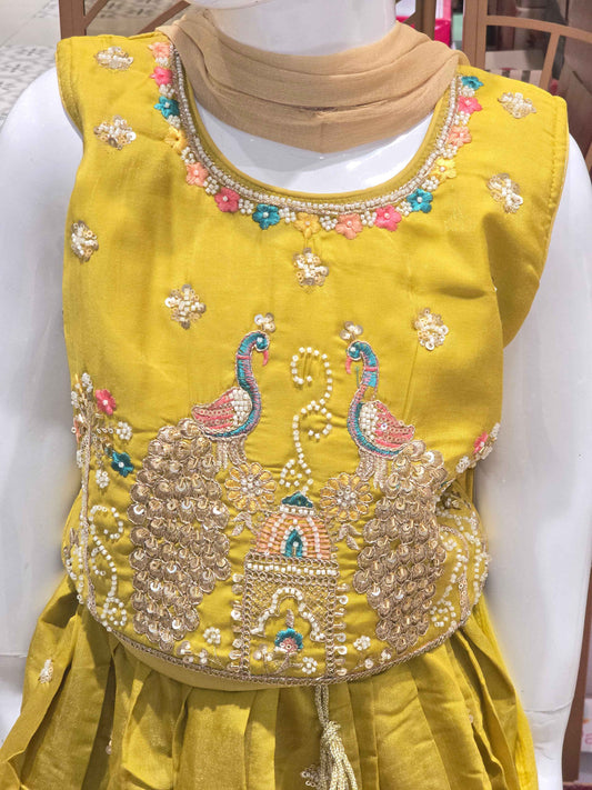 Chinon material yellow colour ethnic wear. beats & sequence work on peacock designed top and thread work on round neck, with ladkans