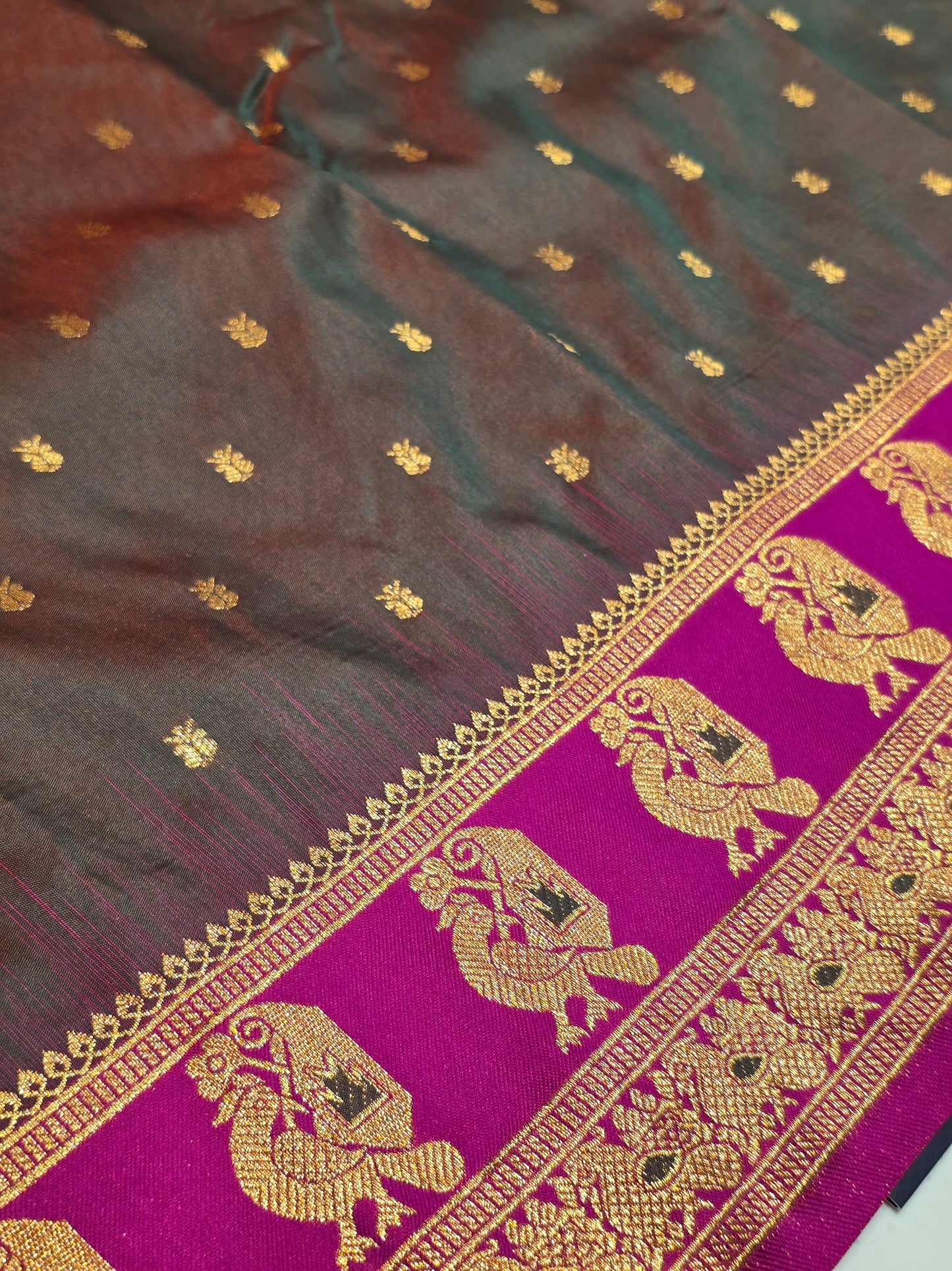 Semi soft silk with butta across the body rich pallu , traditional border