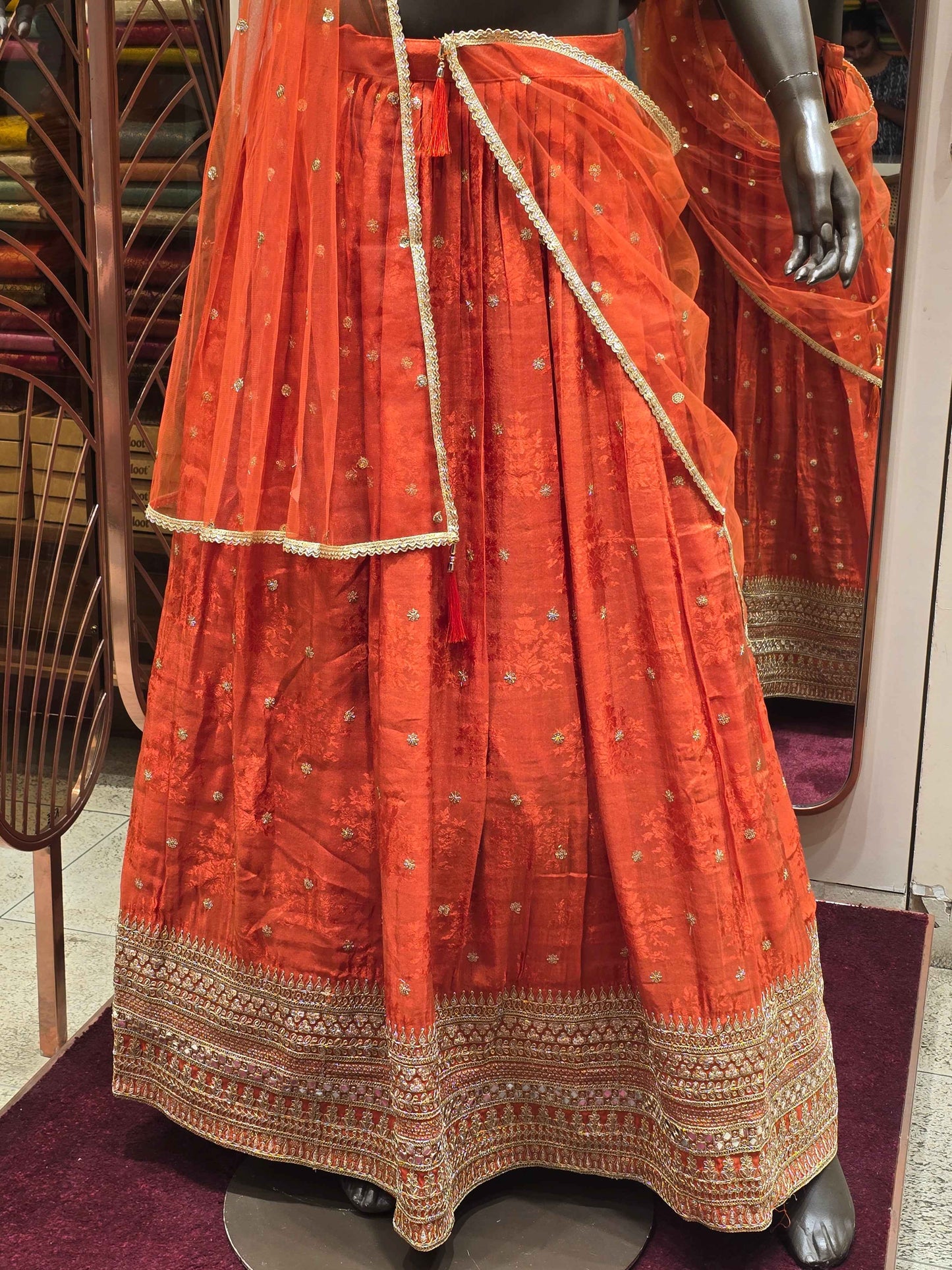 Tissue silk material lehenga for women with zari work border and motifs
