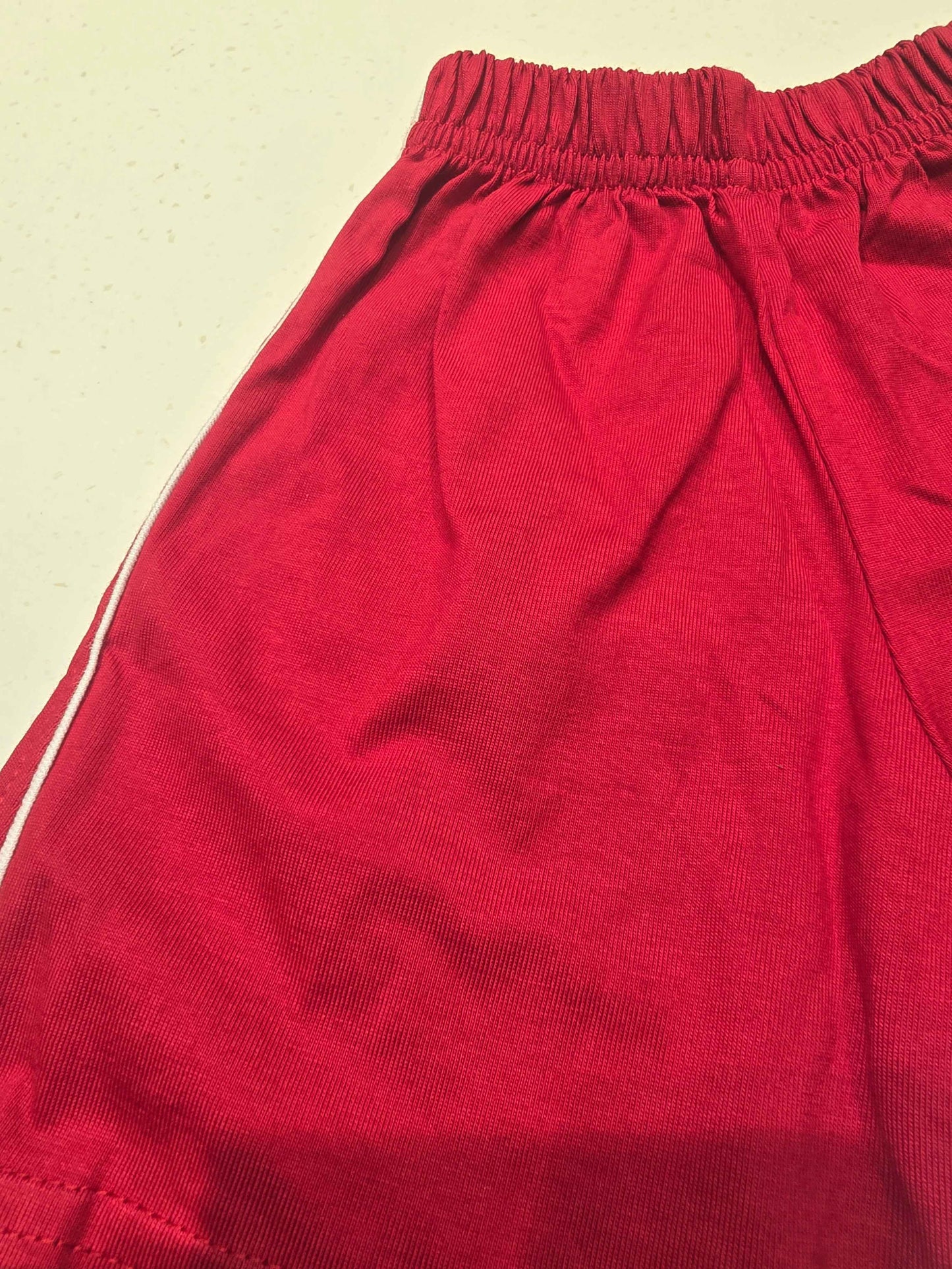 Cotton material red colour shorts with round Elasticable