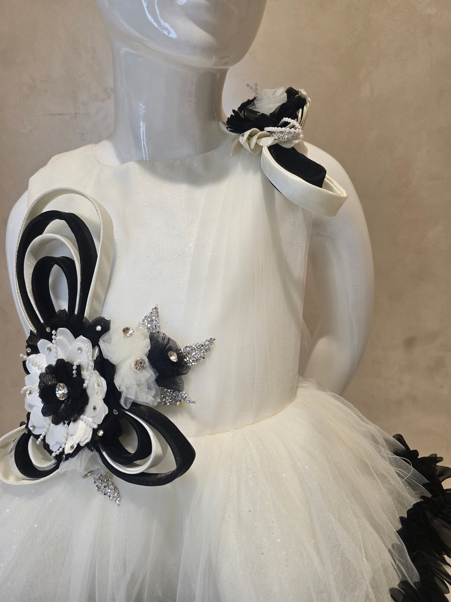 Girls Net Party Wear Short Frock in White and Black with Floral Brooch Waist Design and Round Neck for Special Occasions