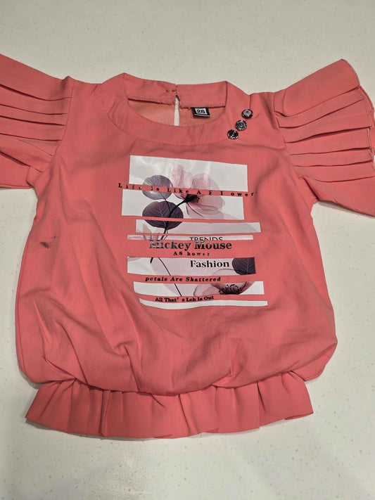 pink or peach-colored western-wear top for young girls
