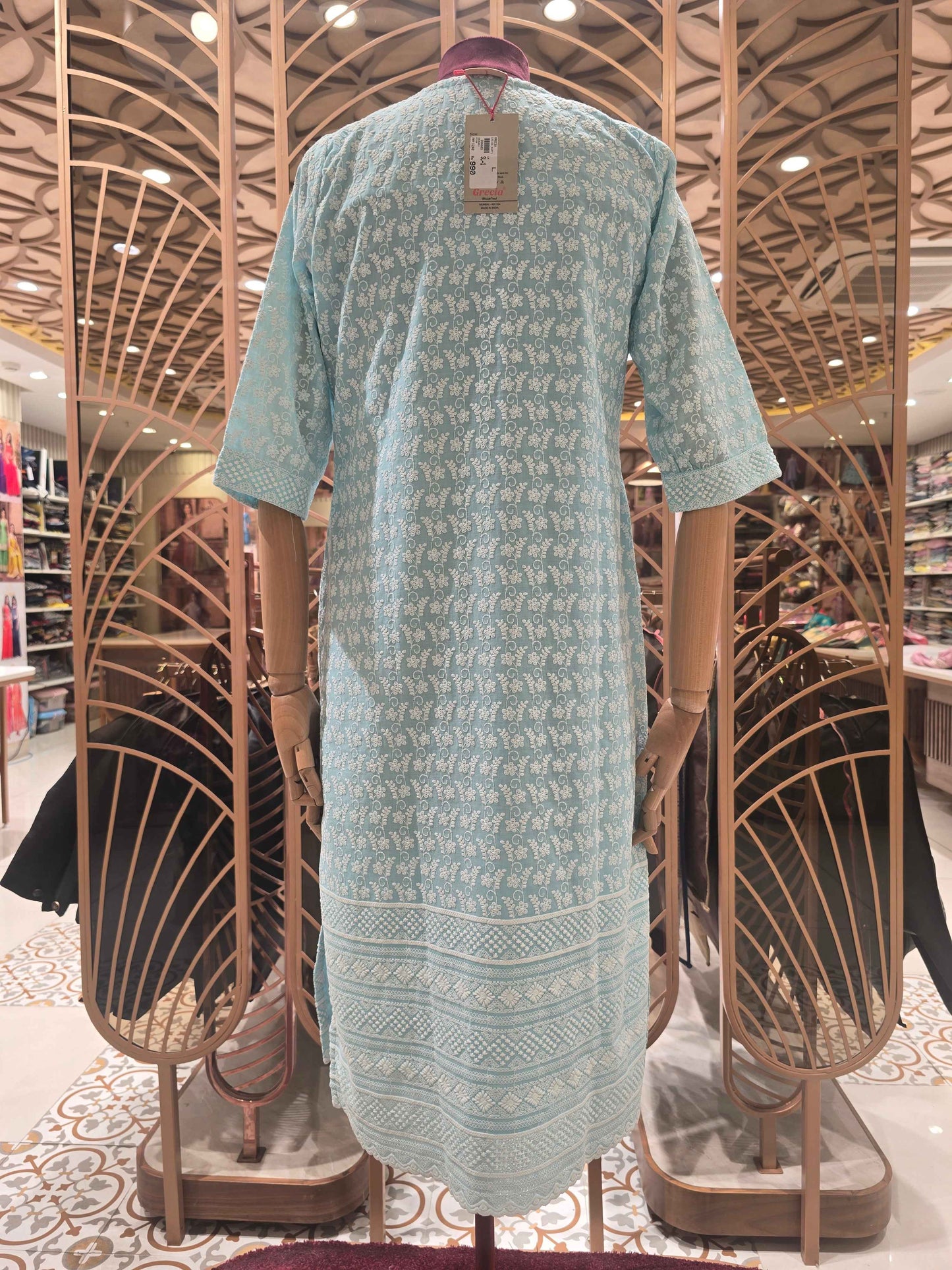 Cotton material blue color with white embroidery work over the body