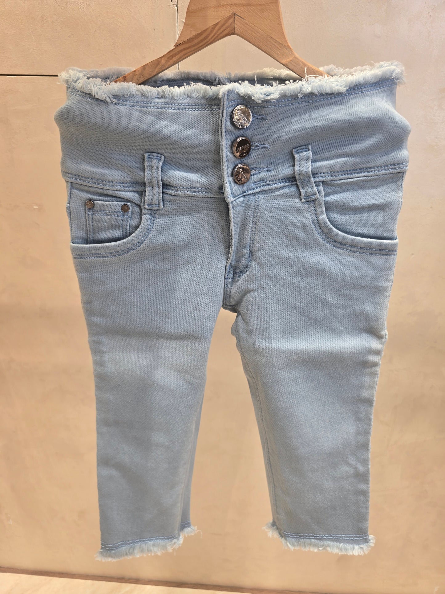 Sky blue colored denim jeans capri pant with 3 button and waist thread-cut design
