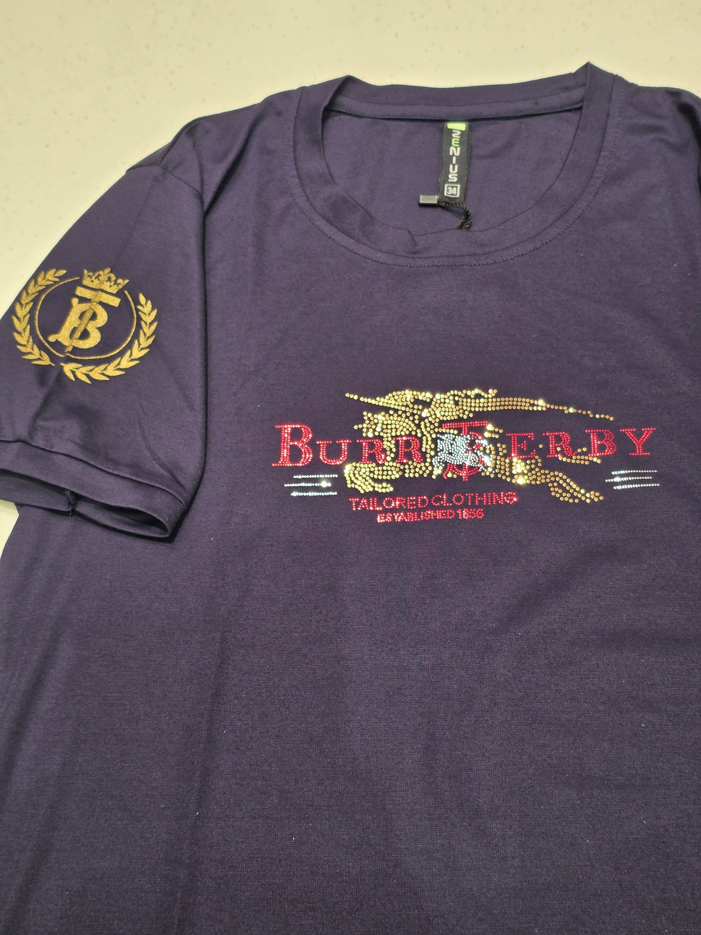 navy blue t-shirt featuring a stylized graphic inspired by the luxury brand Burberry.