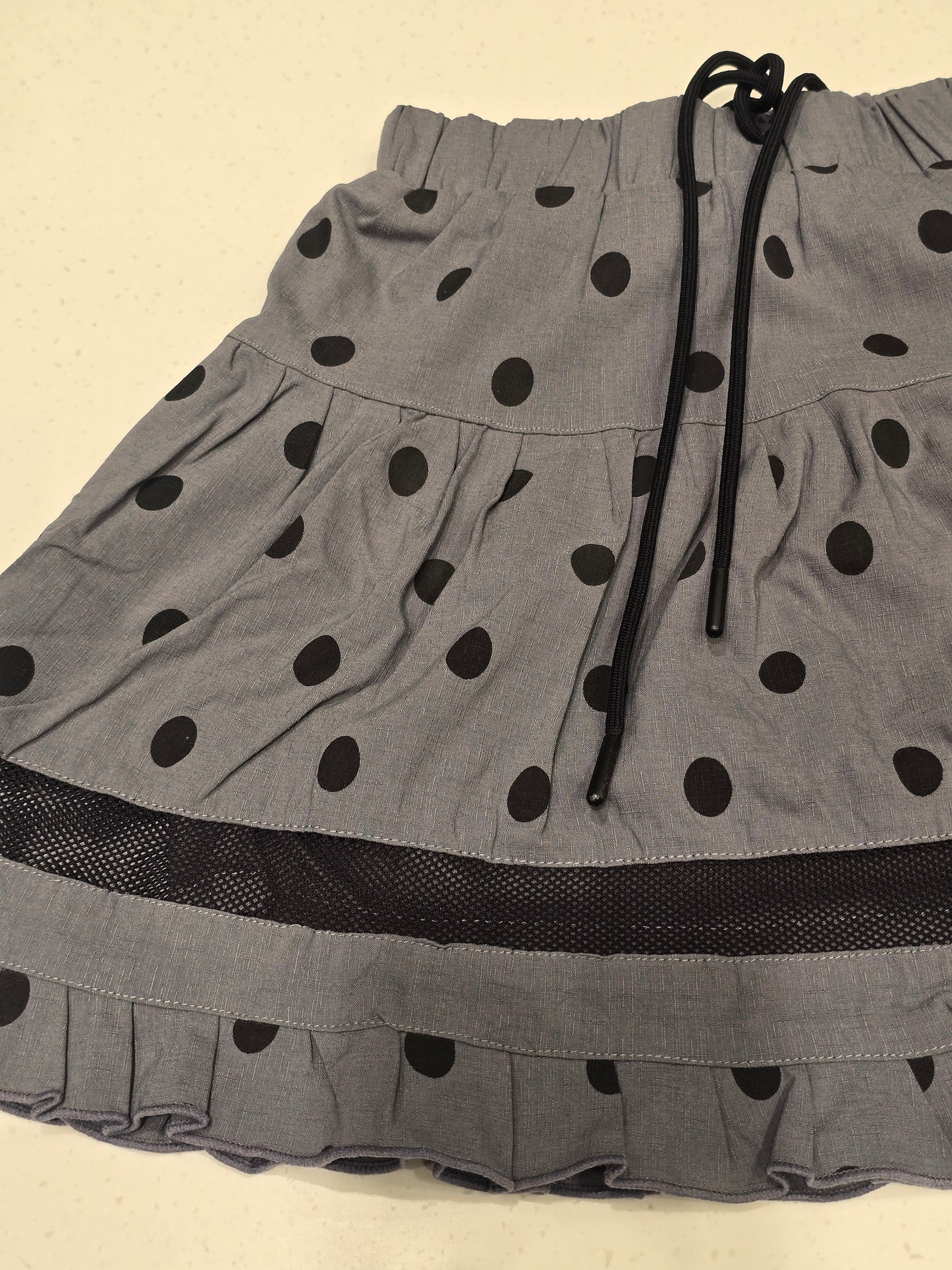 grey tiered mini skirt with black polka dots