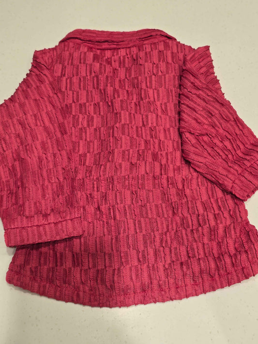 pink, crimp-textured button-down shirt featuring a cinched elastic waist belt, a spread collar,