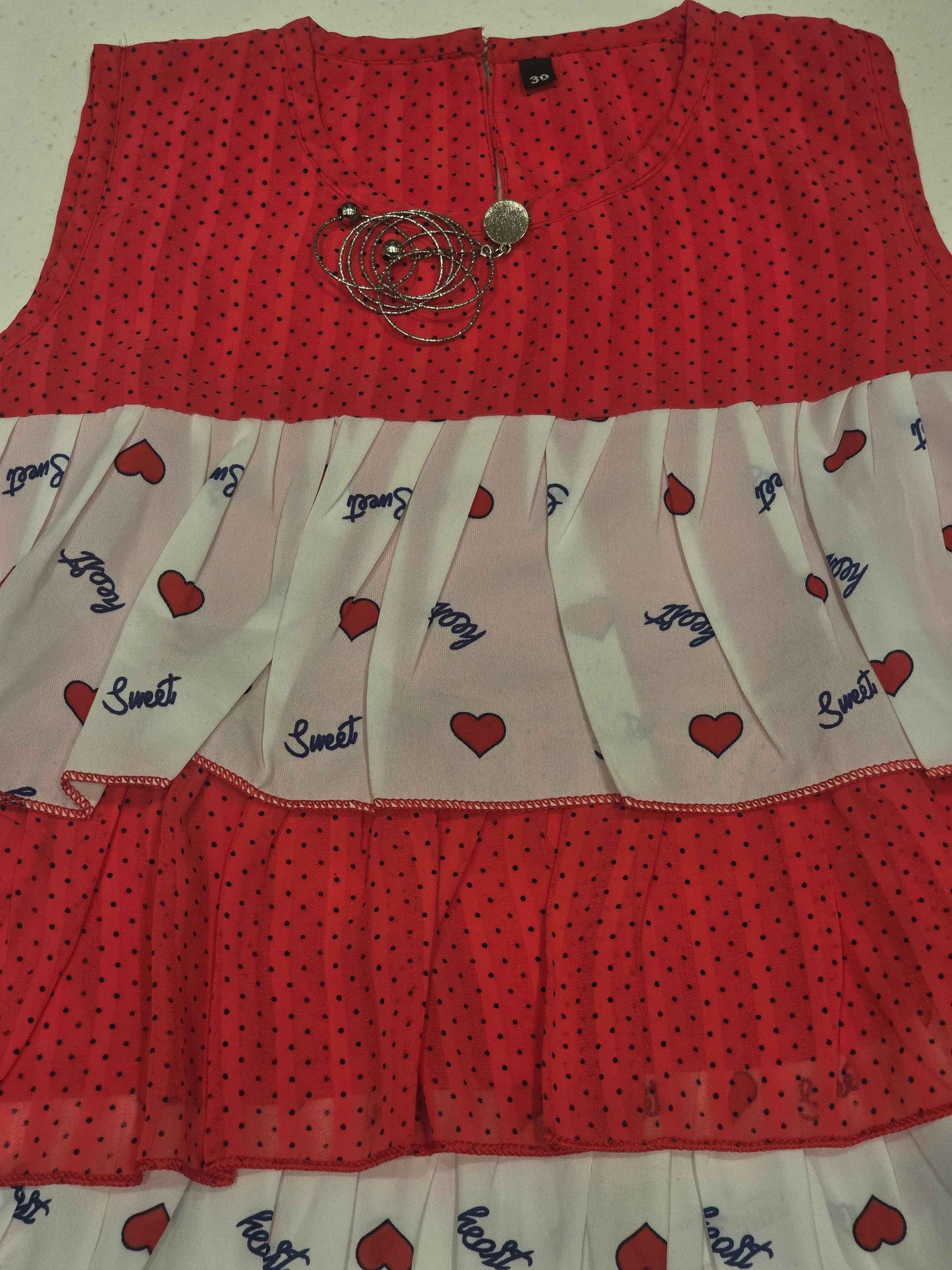 kids' tiered frill dress featuring alternating horizontal layers of patterned fabric.
