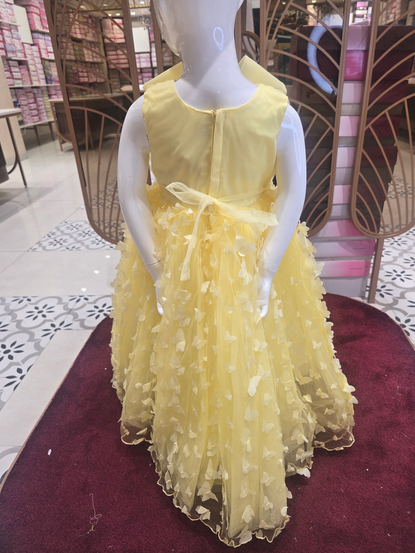 Lemon Yellow Knitted Party Wear Gown for Girls with Butterfly Cutwork Design and Detachable Flower Detail