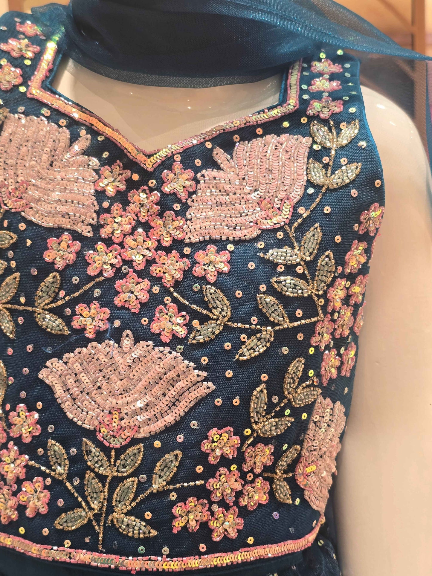 Knitted material Teel blue colour bridal lehanga wuth multi colour embroidery and speghetti top & star neck