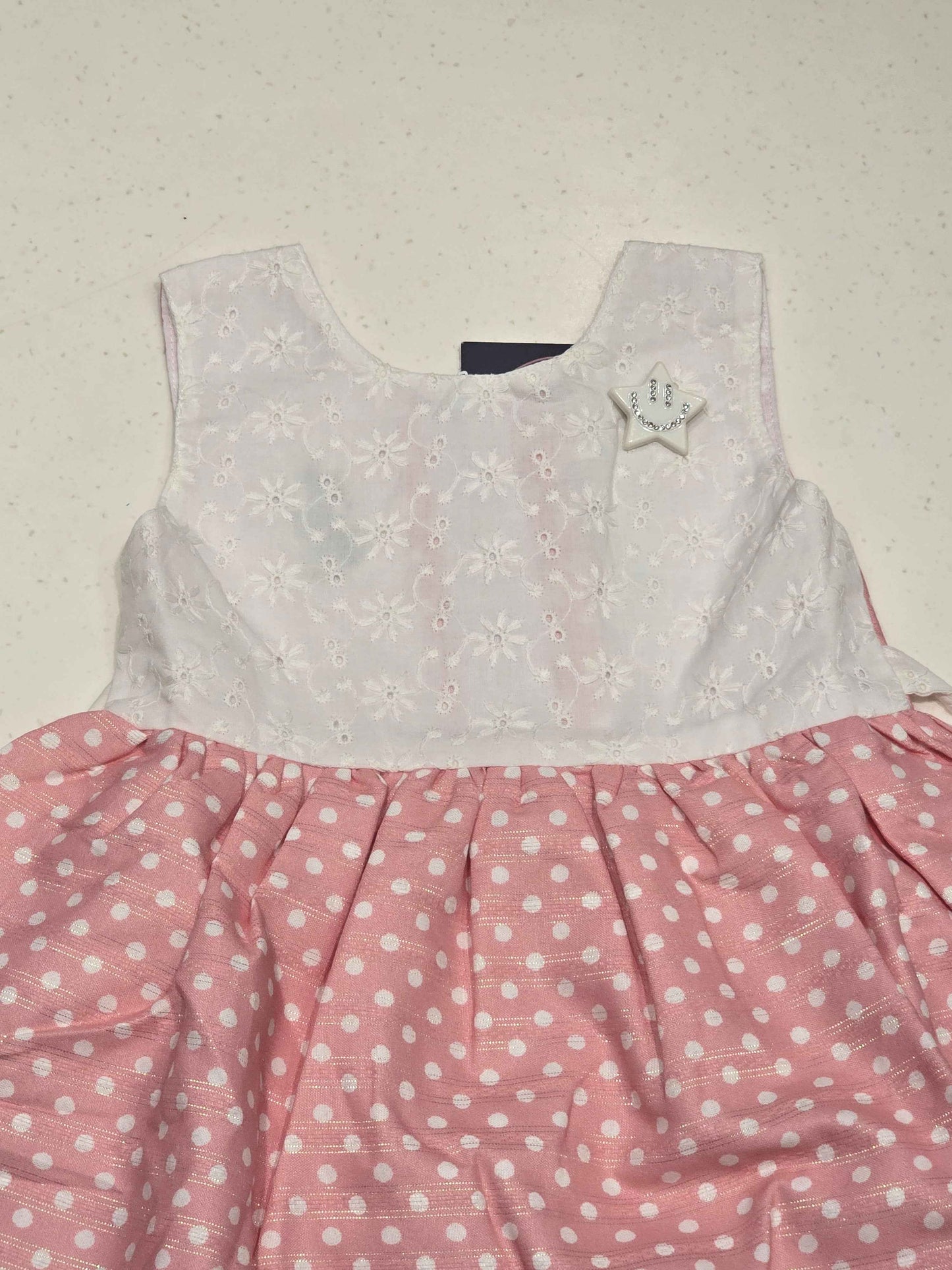 sleeveless, fit-and-flare baby cotton frock dress featuring a color-blocked style.