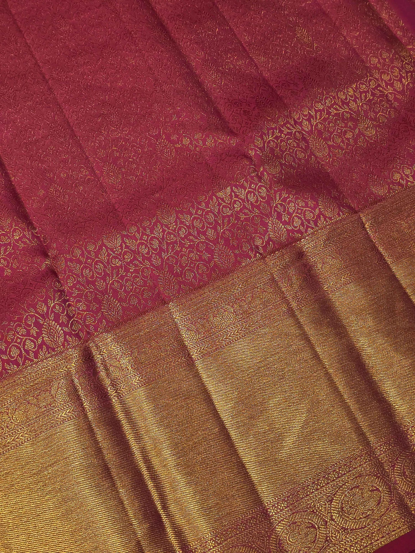 Pure handloom kanjivaram brocade Rani pink coloured silk saree with golden fancy design over the body and rich pallu