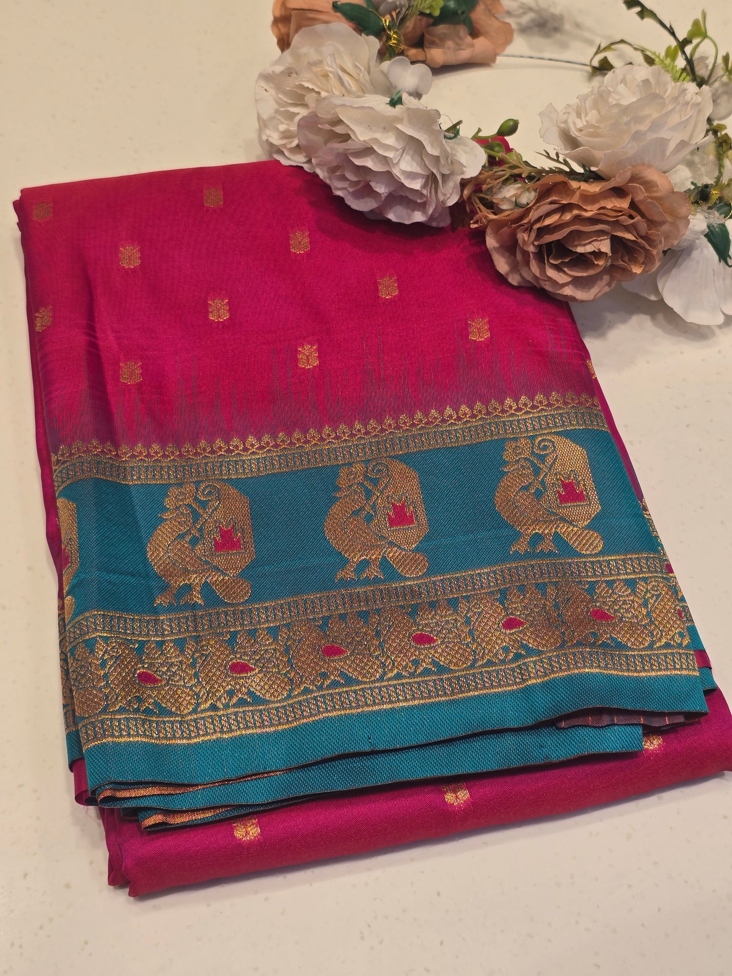 Semi soft silk with butta across the body rich pallu , traditional border