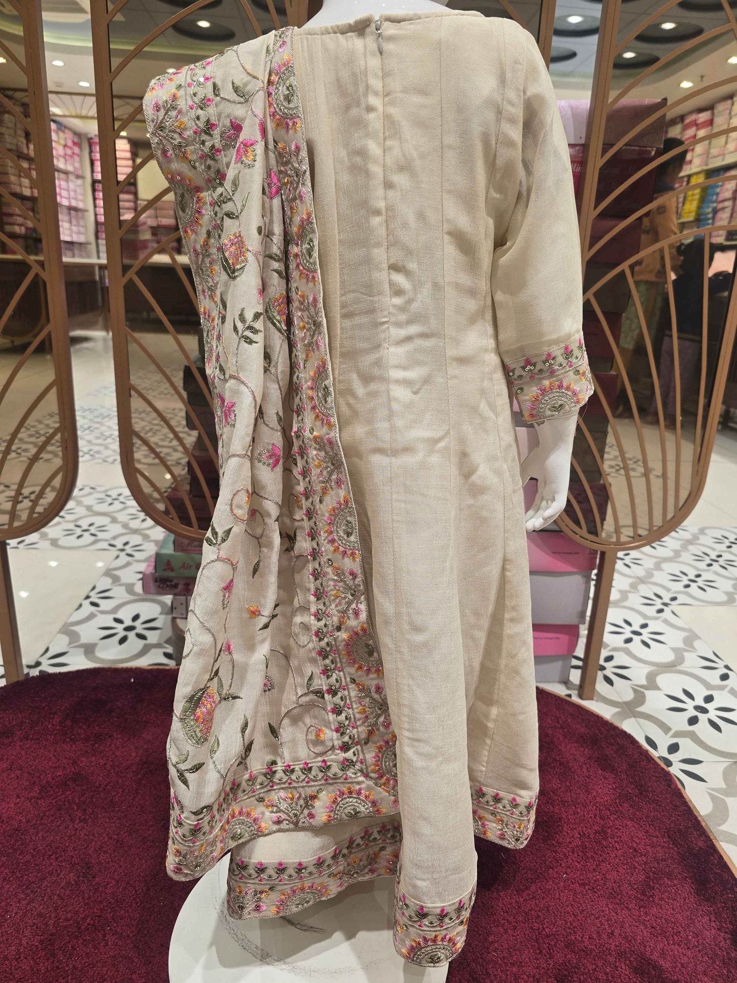 Crepe material cream color Anarkali for girl with multi color thread work with grand dupatta