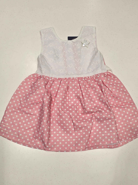 sleeveless, fit-and-flare baby cotton frock dress featuring a color-blocked style.