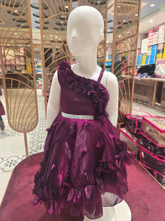 Organza material purple colour frock with flower cut design on border and bottom skirt left shoulder had speghetti with floral cut