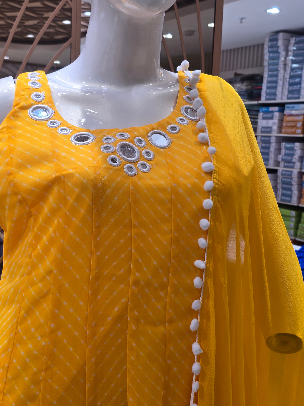 vibrant yellow Anarkali suit set.