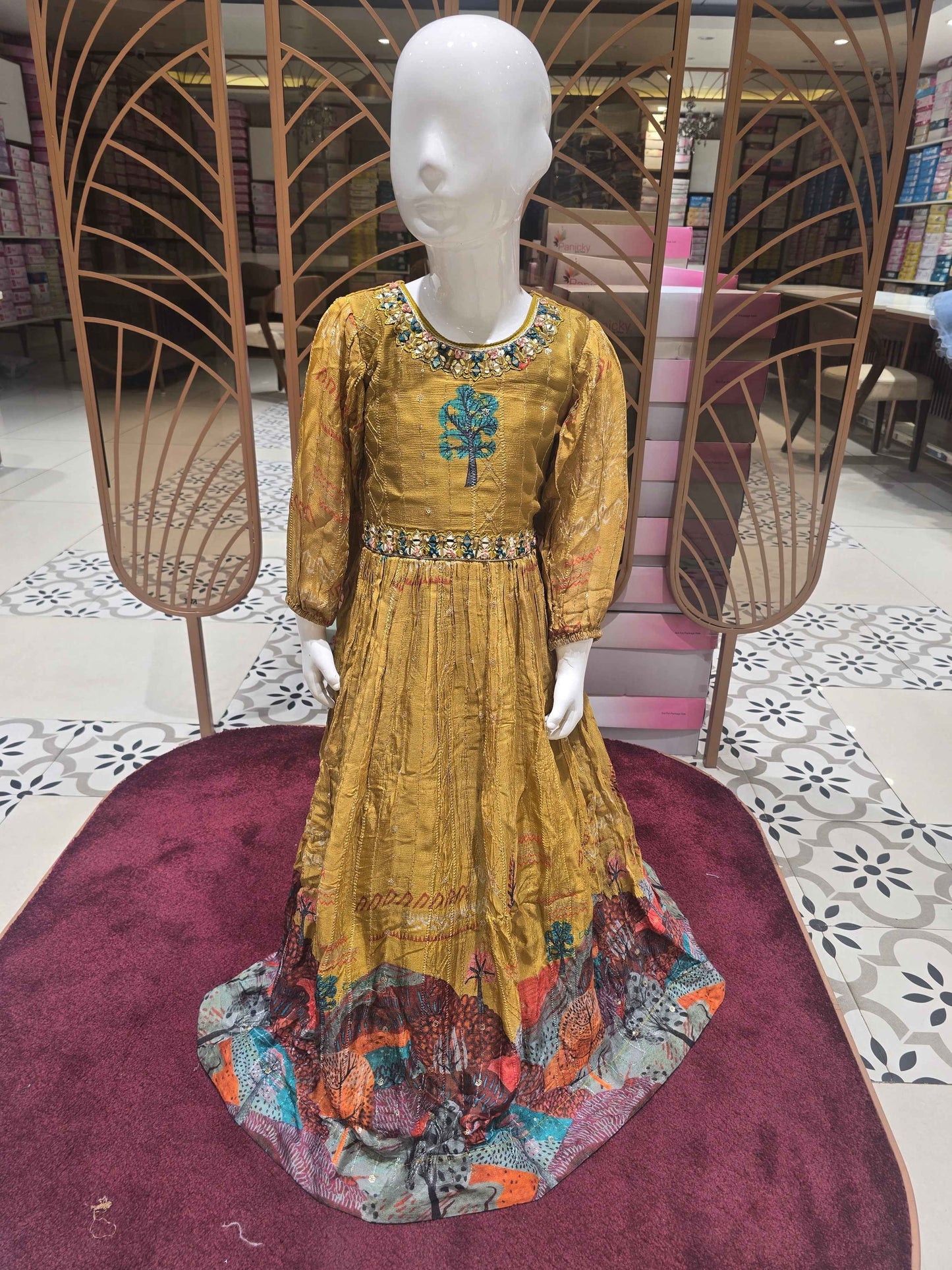 Crepe sequence material mustred color ethnic wear gown with mirror work on neck and waist