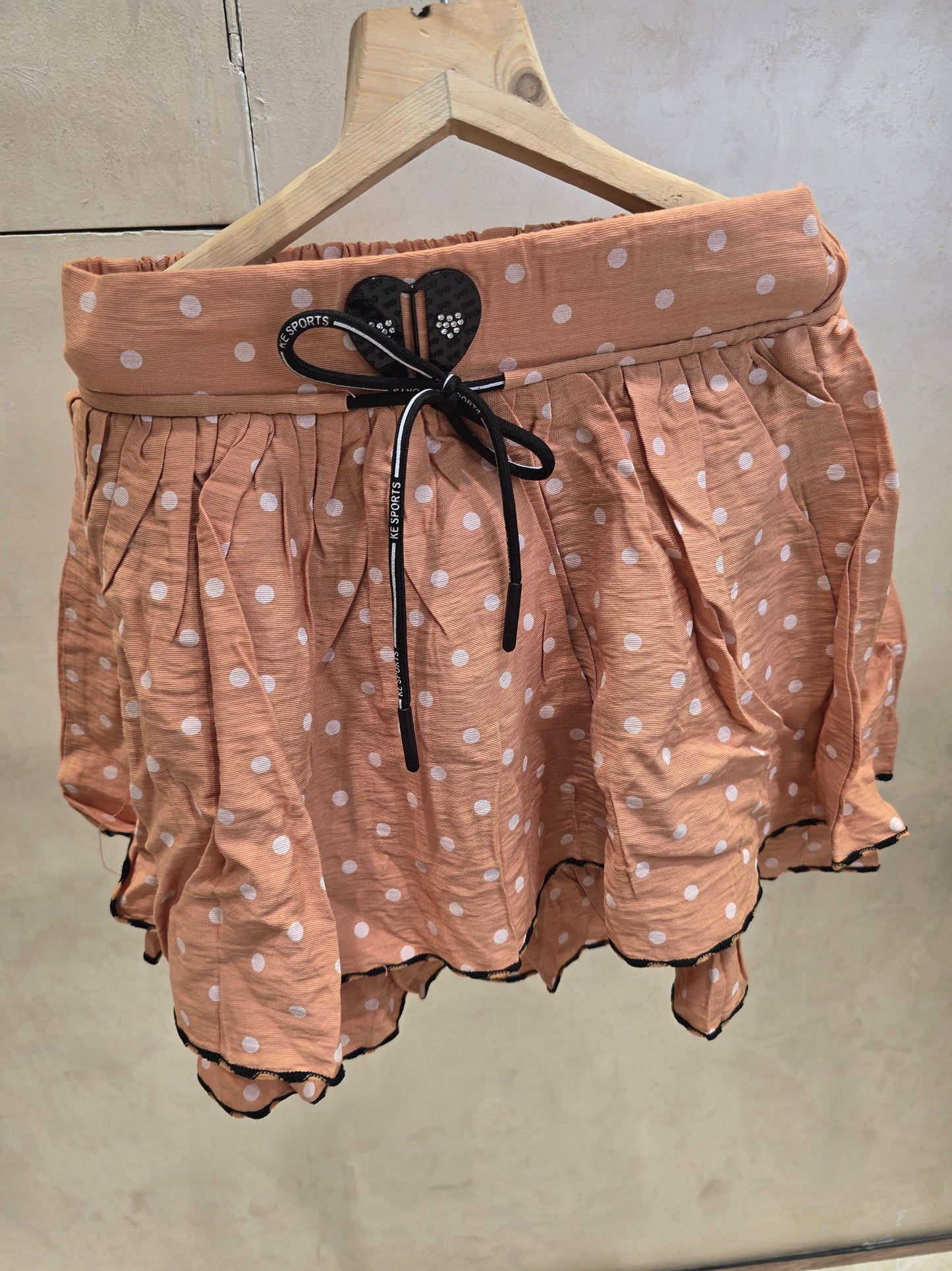 Girls Cotton Casual Wear Skirt in Peach with Polka Dot Design, Elastic Waist and Tie Detail for Summer Wear