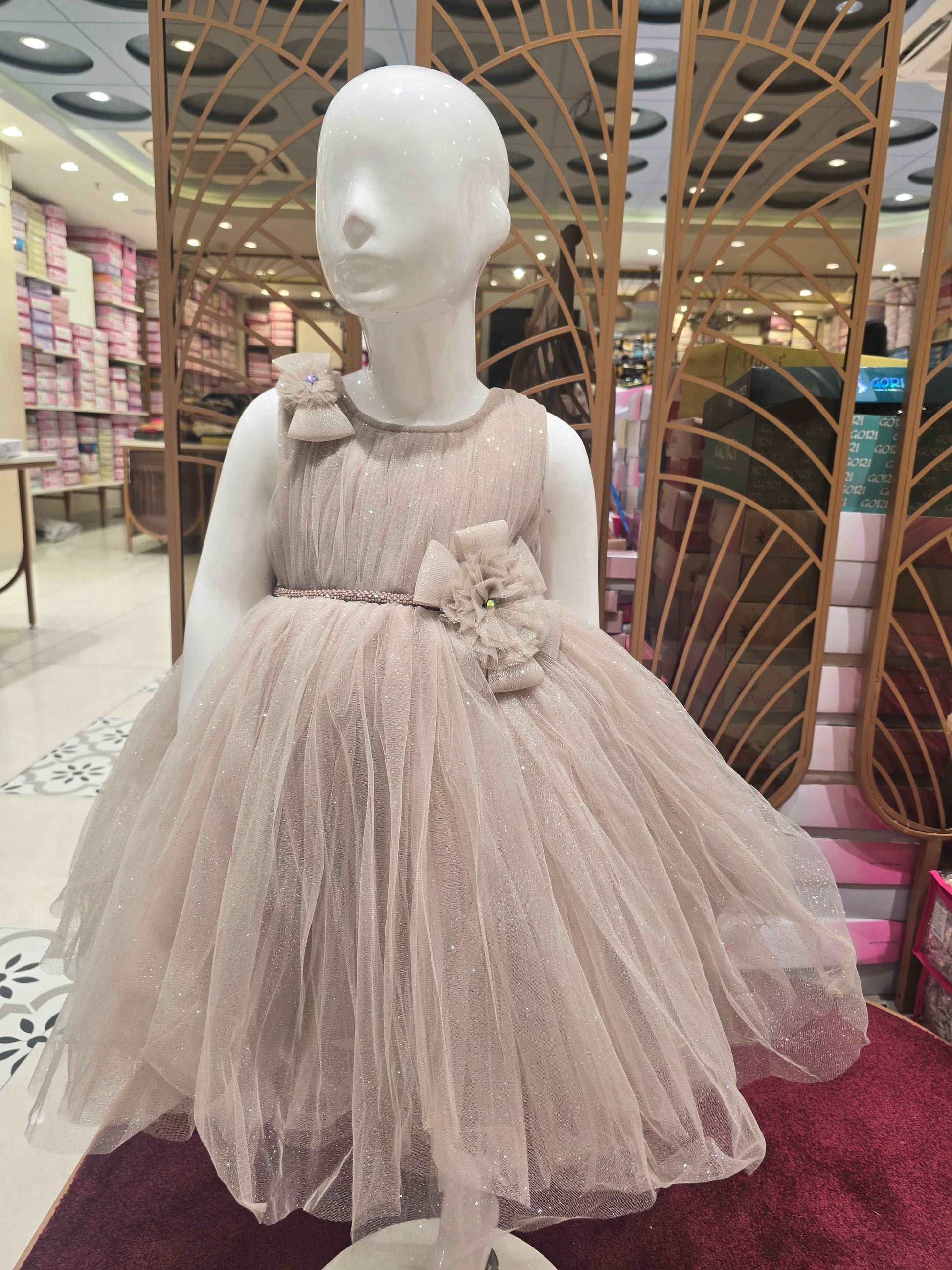 Shimmer Knitted material fawn colour party wear frock with two bow round neck