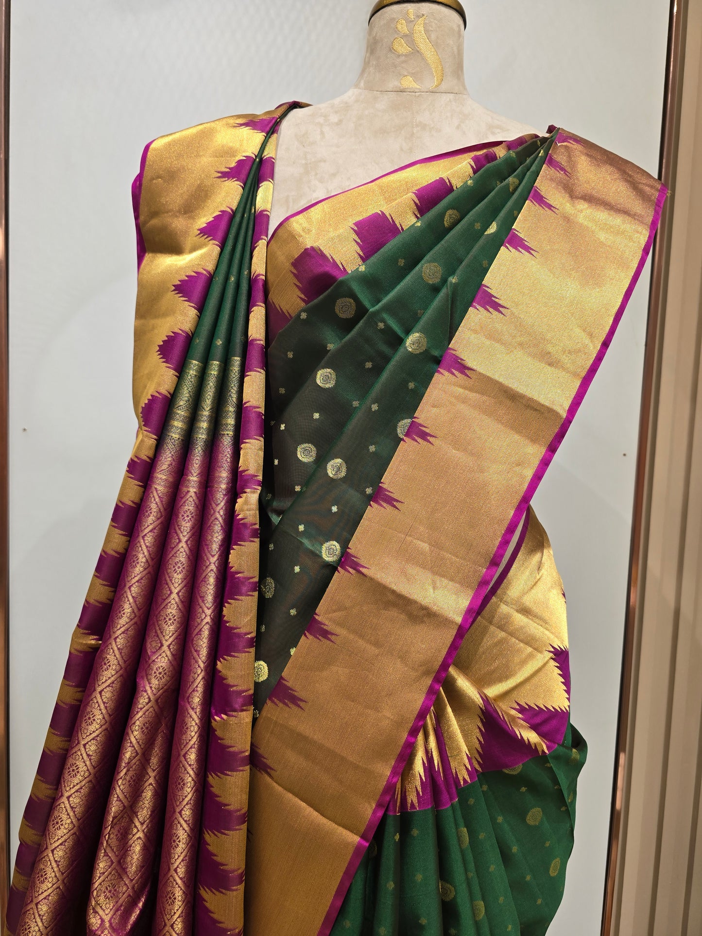Pure handloom Kanjivaram silk saree with temple border and traditional motifs