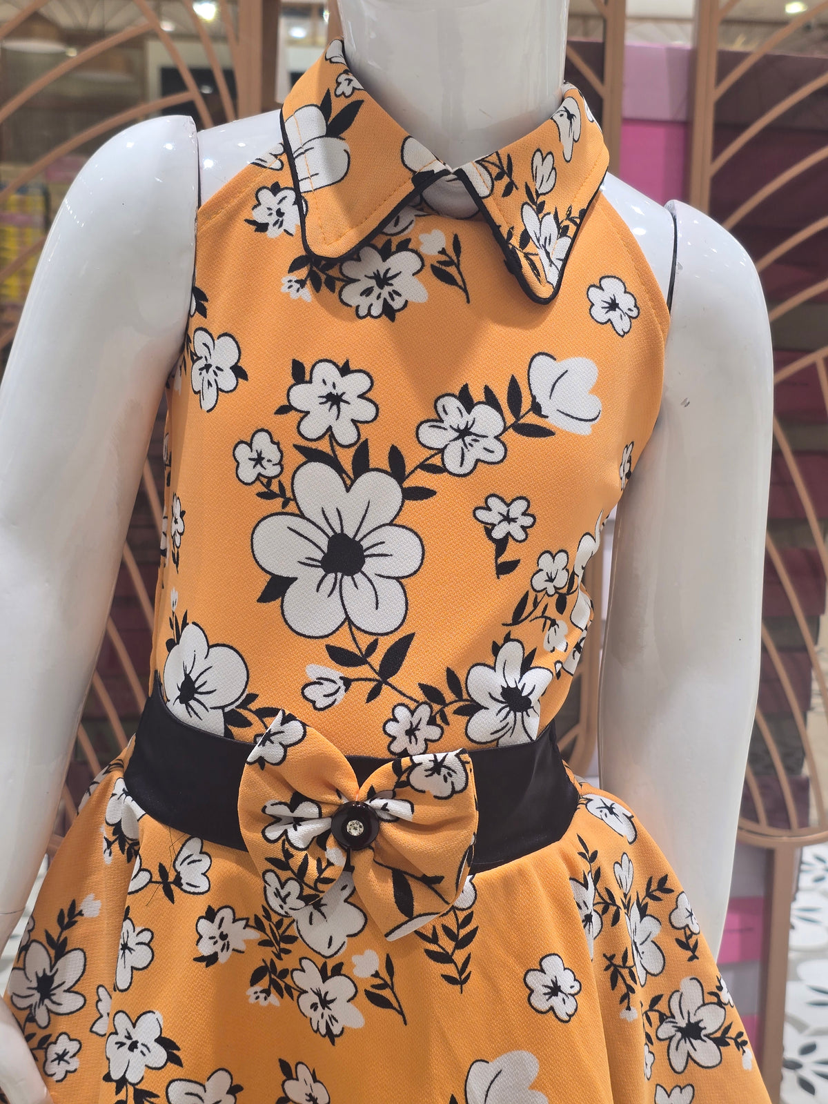 Girls Orange Printed Crepe Short Frock with Bow Waist and I-Neck