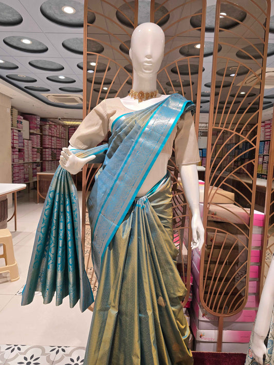 Semi tissue Kanjivaram saree with rich pallu and contrast blouse