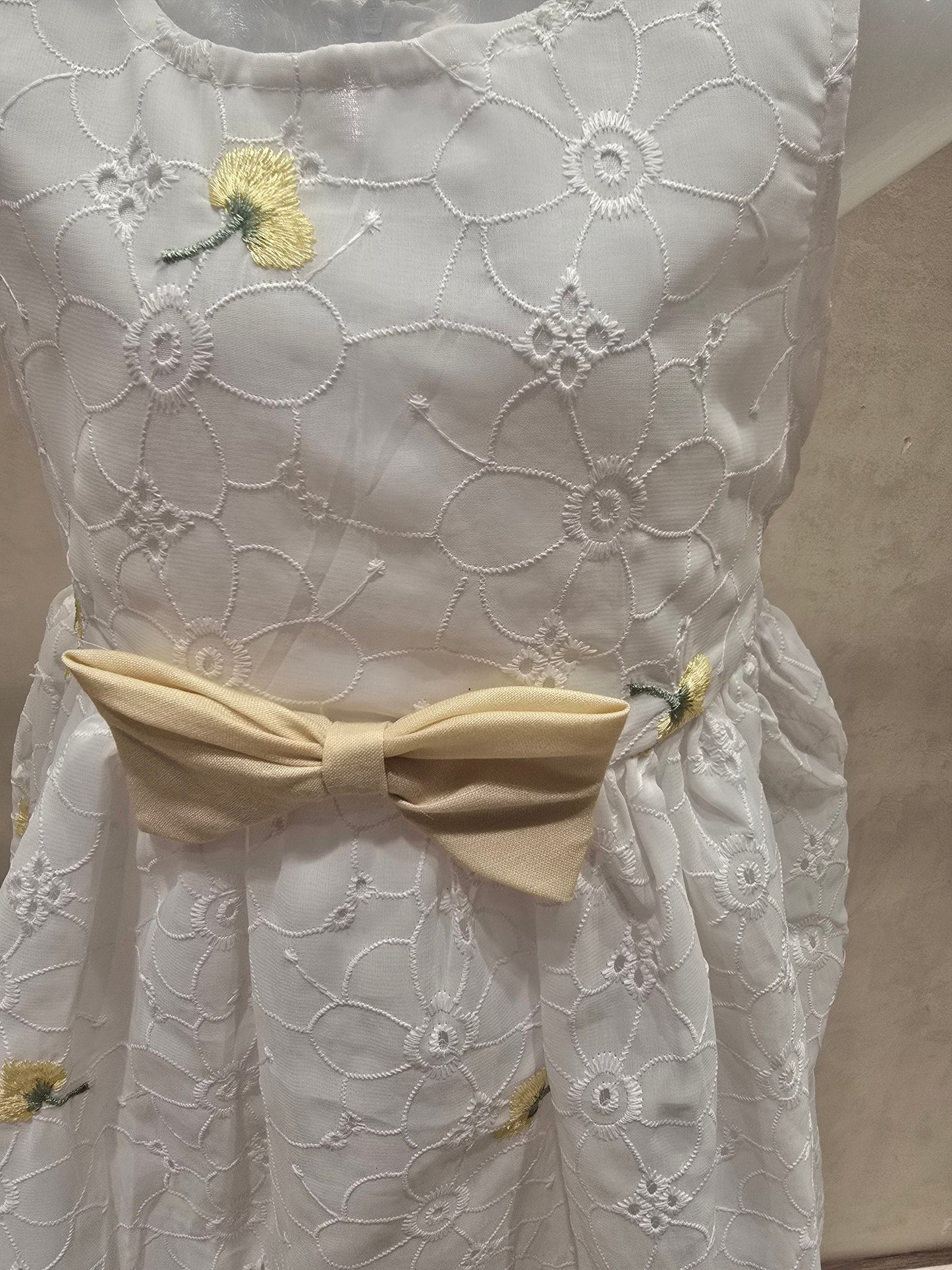 White shiffon fabric with acrobat design with waist yellow bow sleeves less casual wear