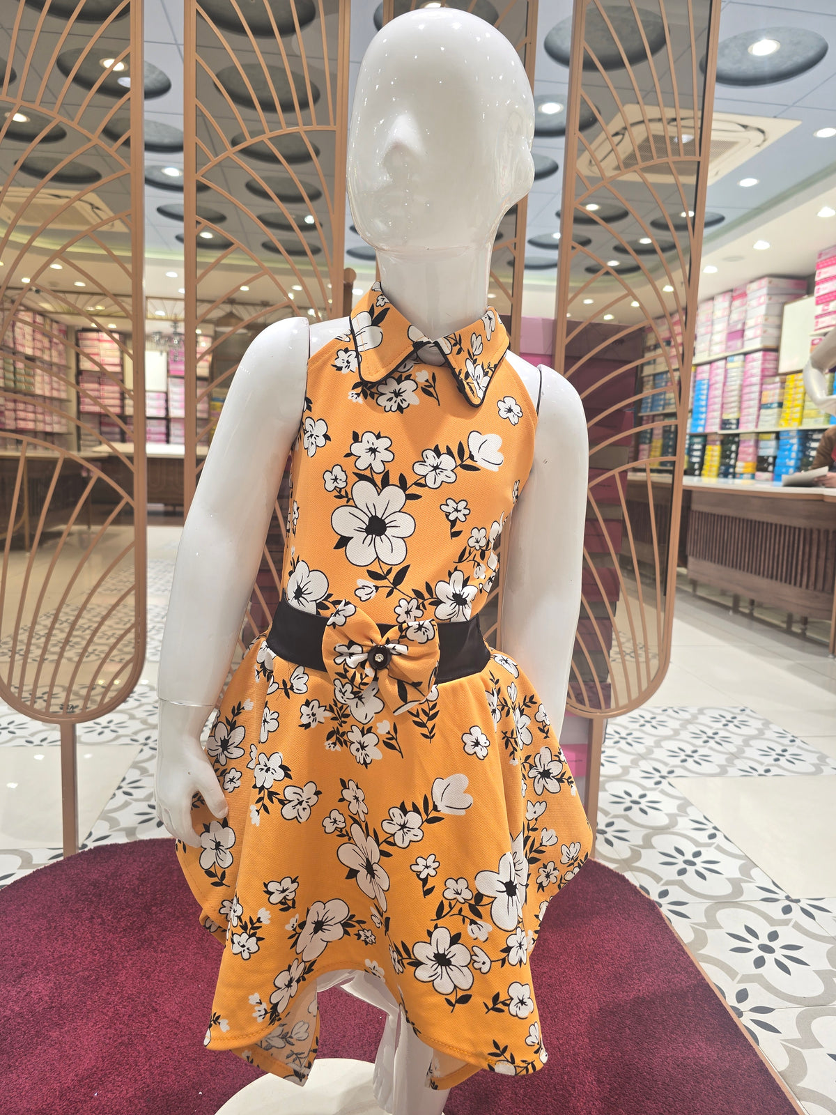 Girls Orange Printed Crepe Short Frock with Bow Waist and I-Neck