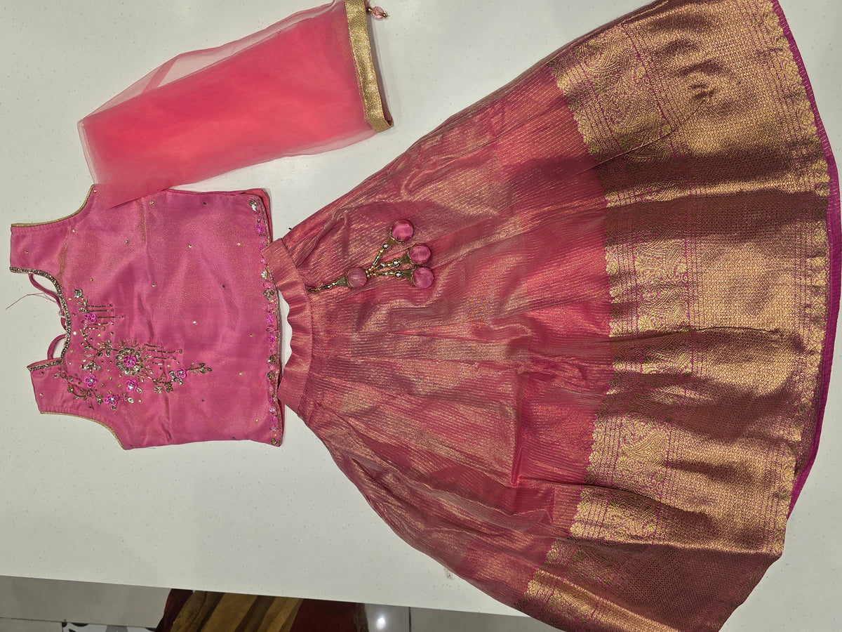 pink and gold lehenga choli set for kids (also known as a Pattu Pavadai
