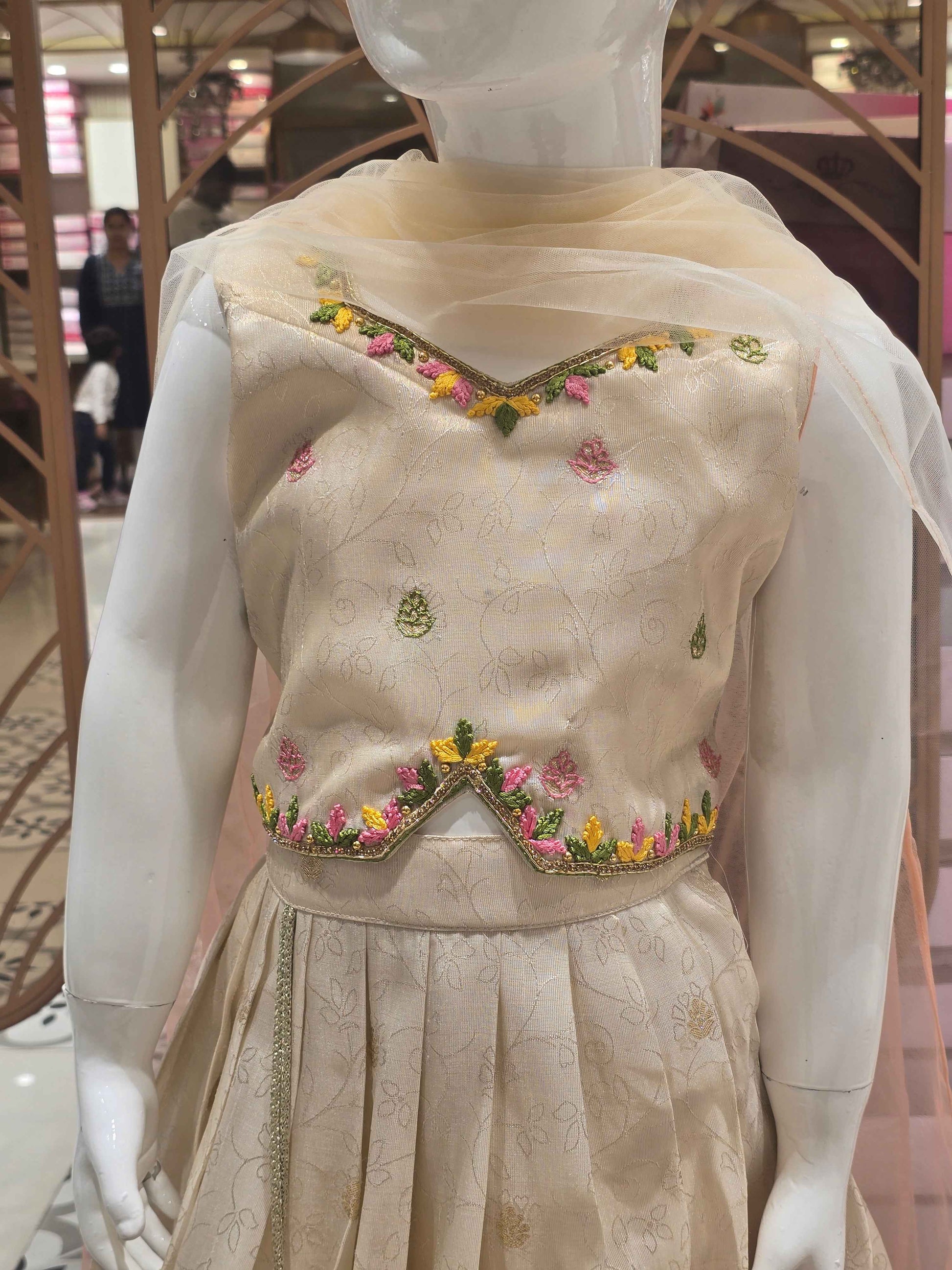 Tissue silk material cream colour ethnic wear with floral prints for garghra and long traditional border. star neck had thread work