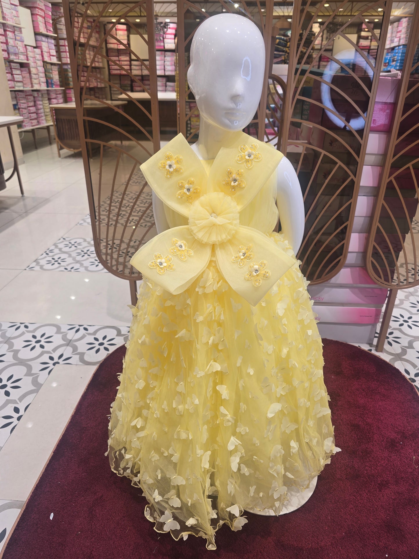 Lemon Yellow Knitted Party Wear Gown for Girls with Butterfly Cutwork Design and Detachable Flower Detail