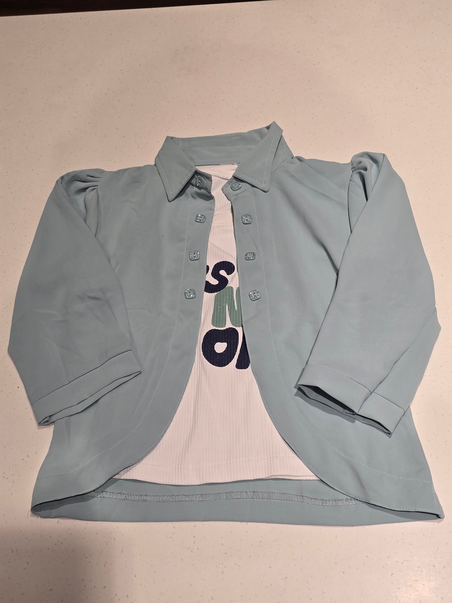 children's layered outfit set featuring an open-front light pastel blue/green overshirt jacket worn over a white graphic t-shirt.