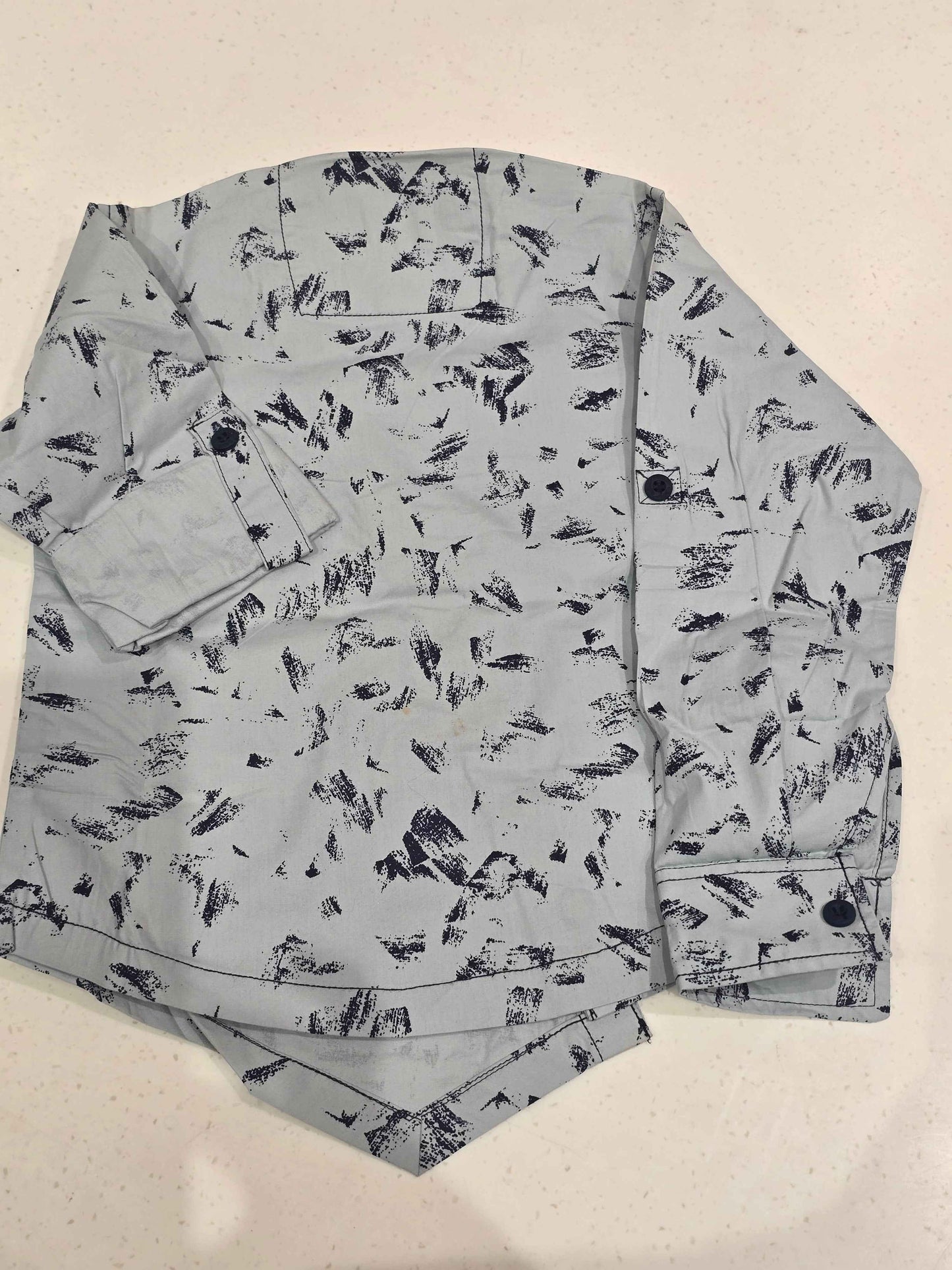 Cotton material white based wuth black printed shirt for boy