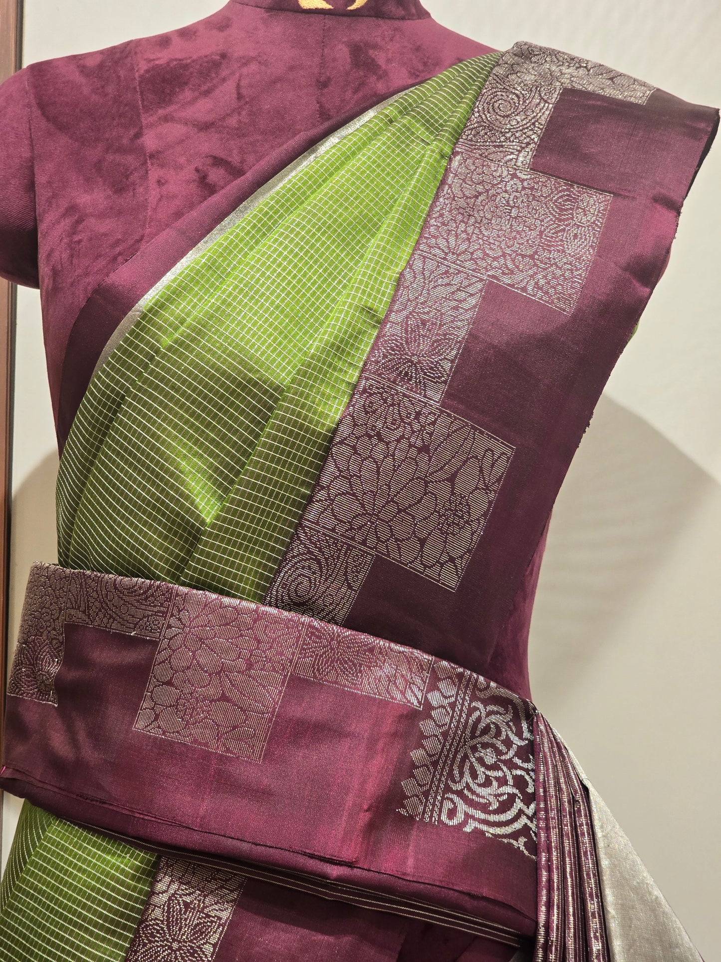 South Indian Kanchipuram silk saree styled with a distinctive modern grid-patterned layout border