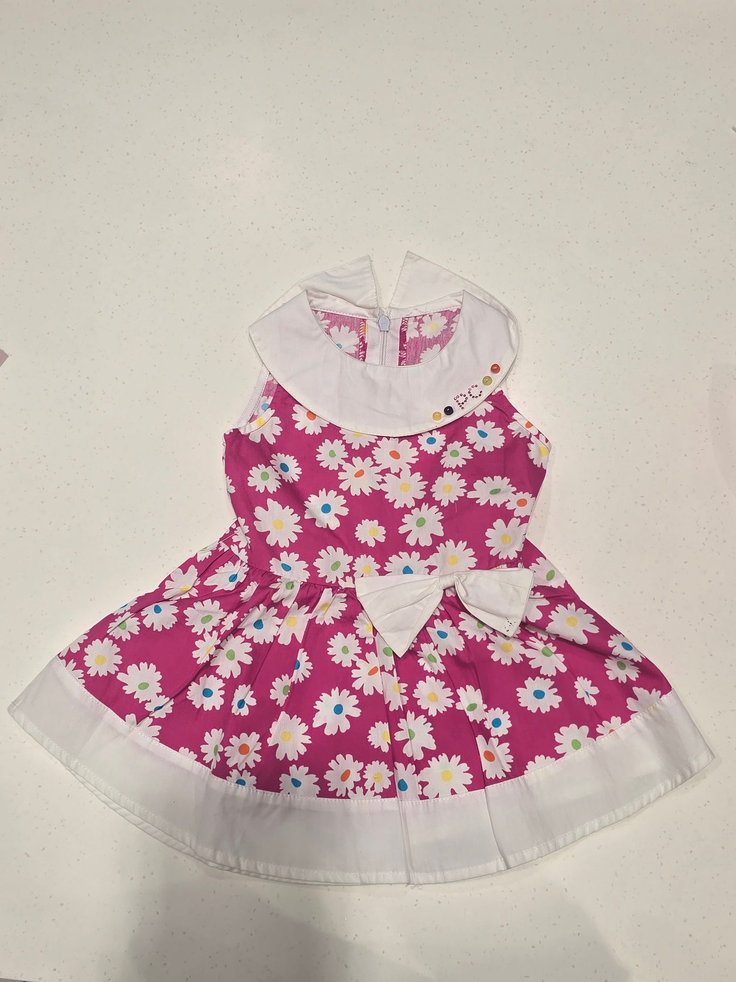 Printed Cotton material baby frock with flower prints and white bow