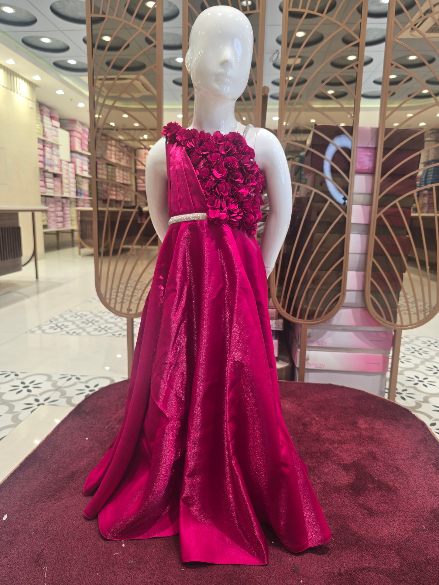 Rani Pink Satin Party Wear Gown for Girls with Spaghetti Strap Style and Half-Side Rose Design