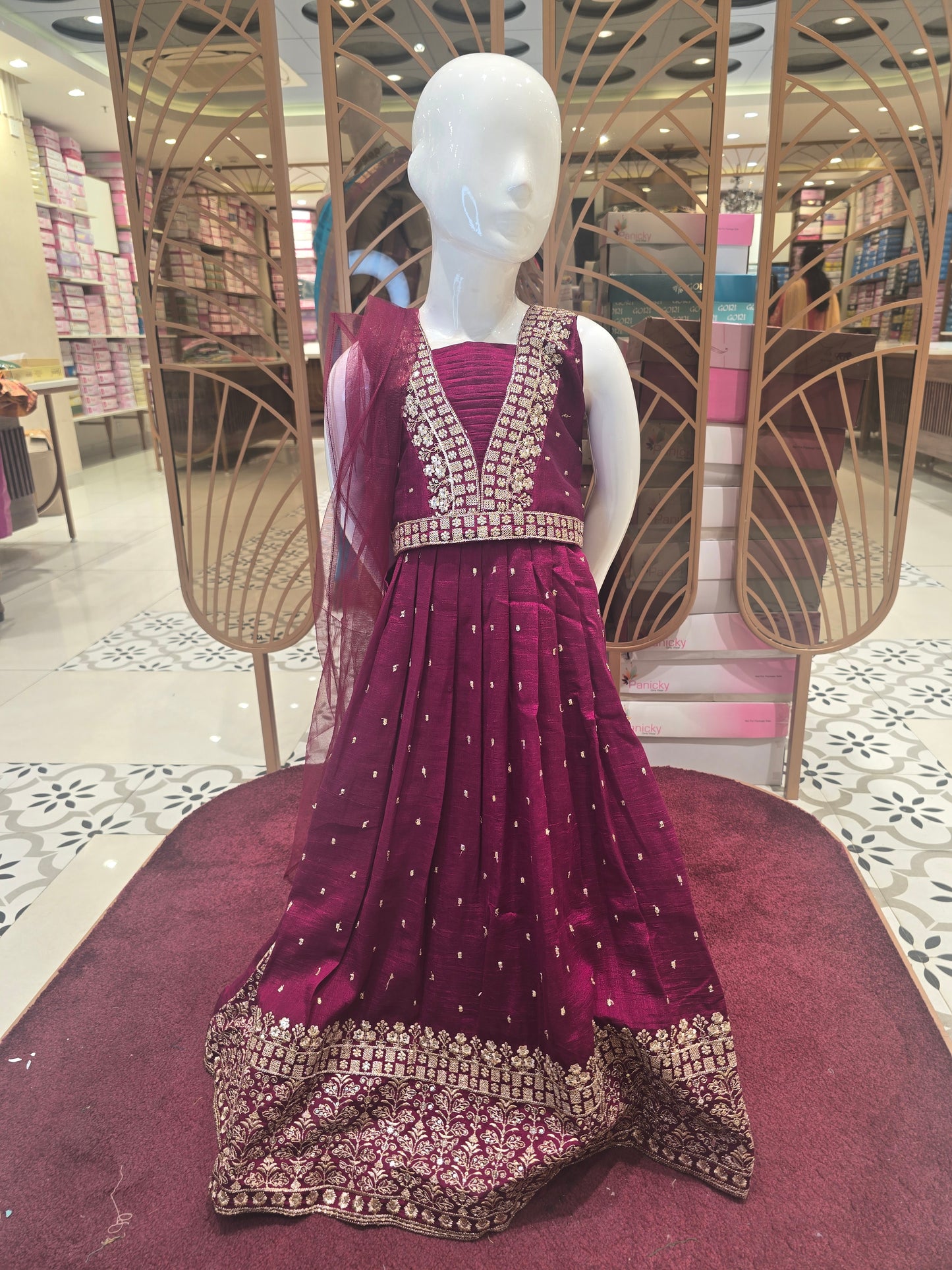 Chinon maroon colored ethnic wear with thread work and small butta for skirt with gold embroidery work for border