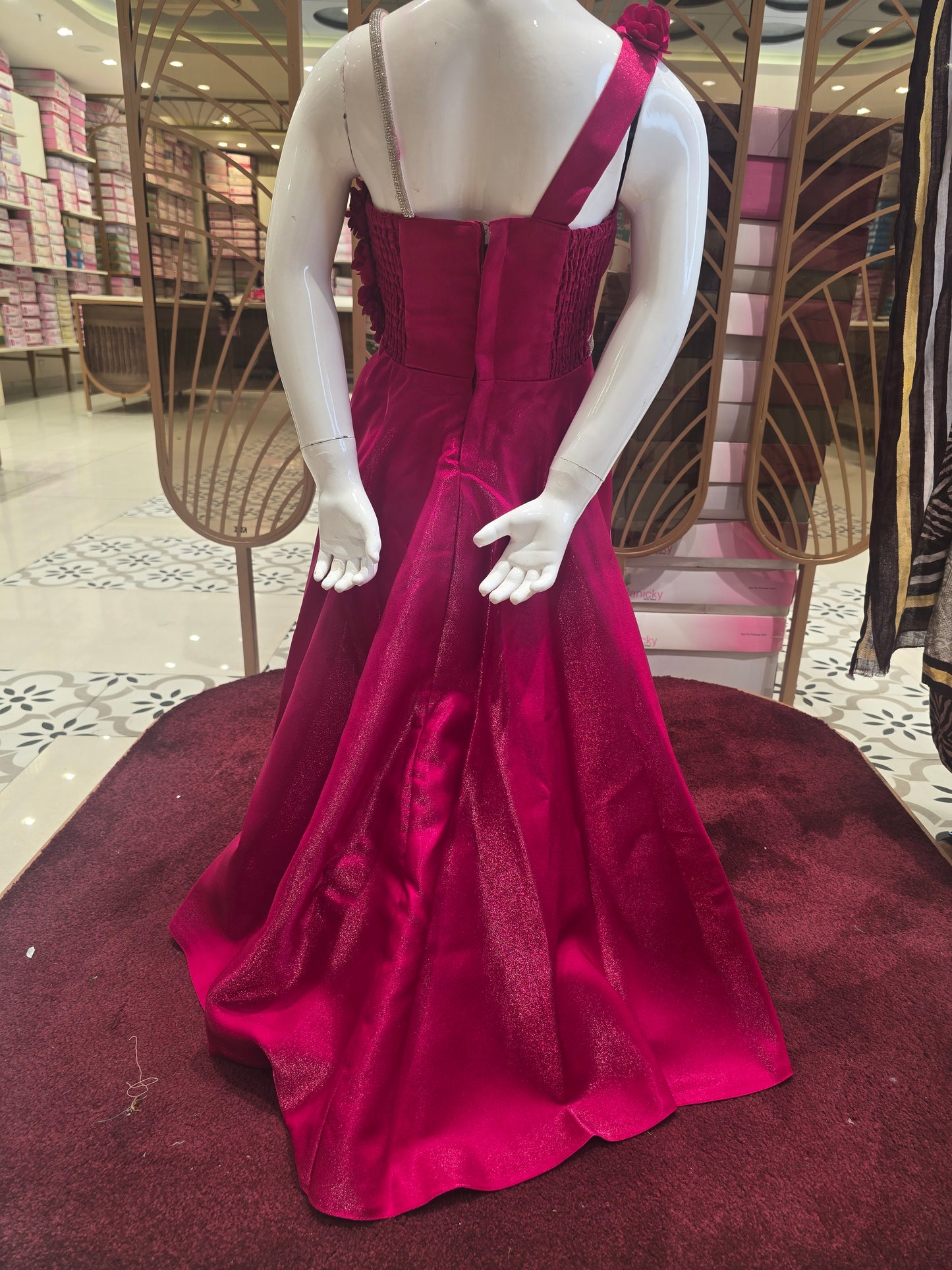 Rani Pink Satin Party Wear Gown for Girls with Spaghetti Strap Style and Half-Side Rose Design