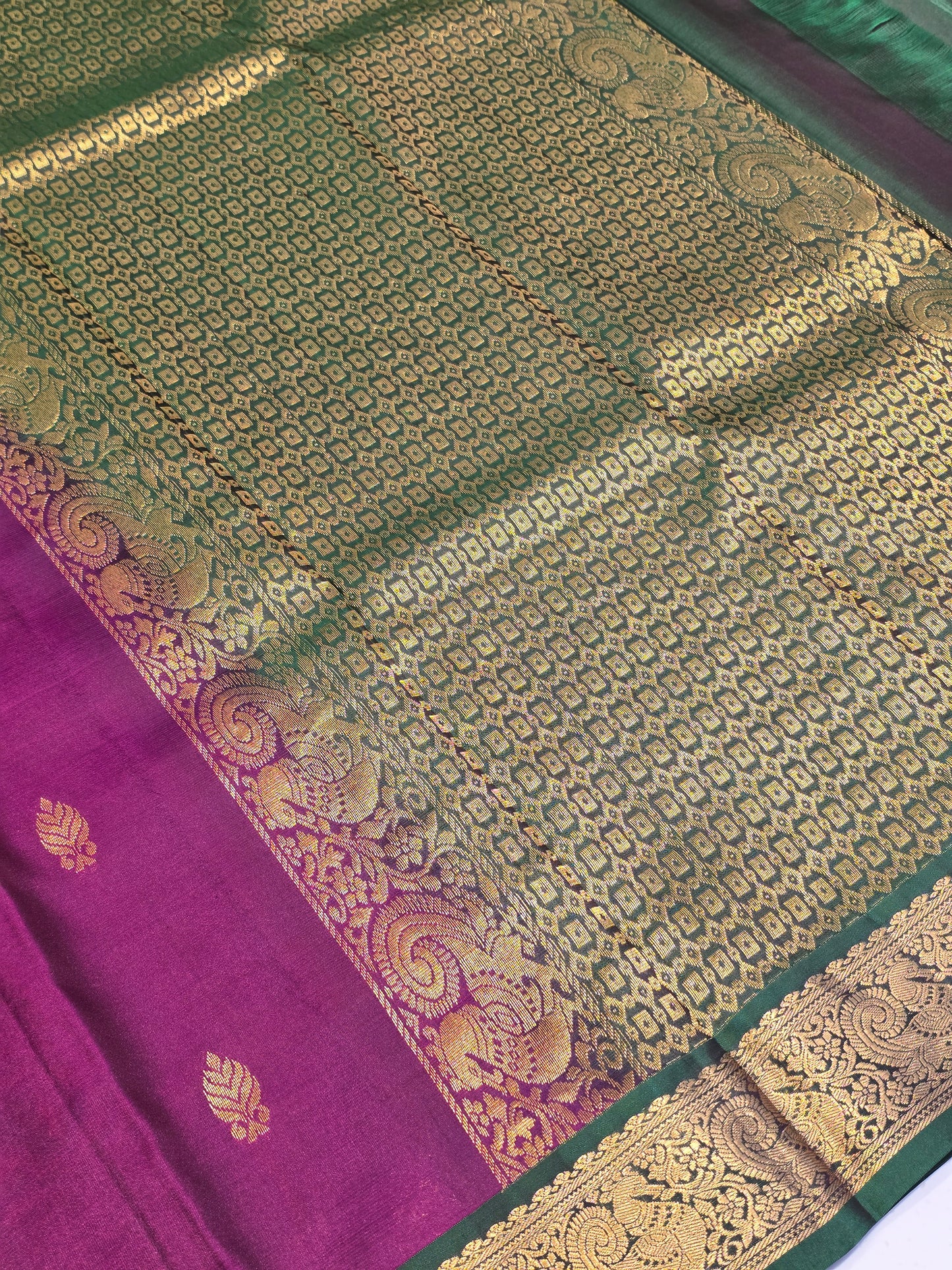 Handloom pure Kanjivaram silk with small leaf styled motifs and small traditional peacock designed border, rich pallu
