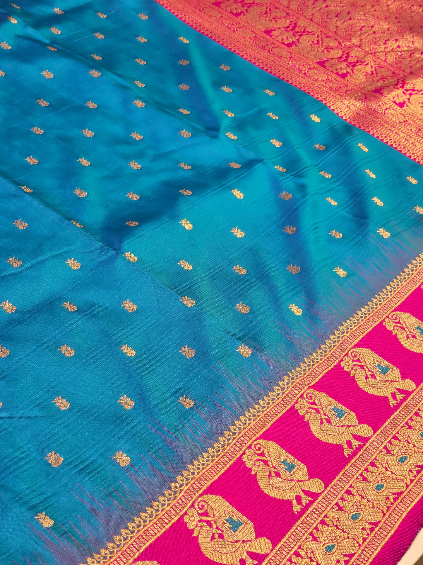 Semi soft silk with butta across the body rich pallu , traditional border