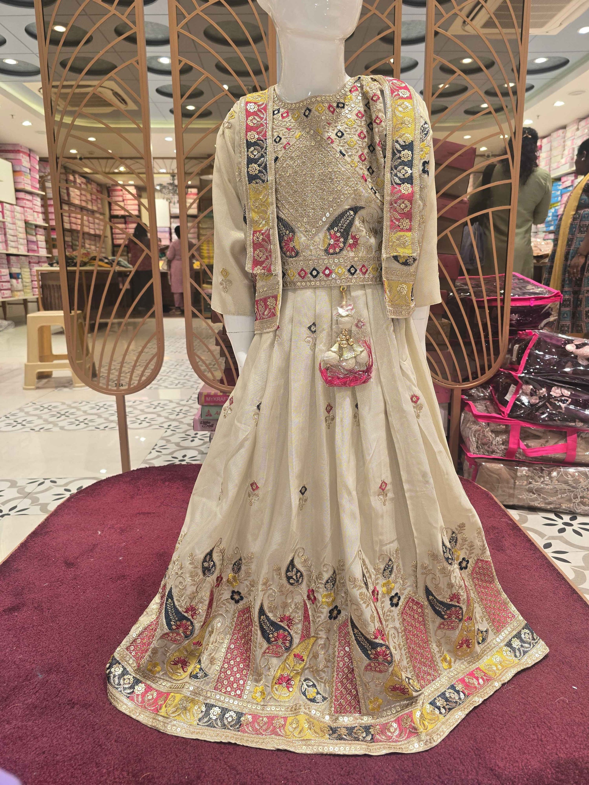 Shimmer material cream colour ethnic wear gaghra with multi colour embroidery, sequence & thread work with ladkans and jacket