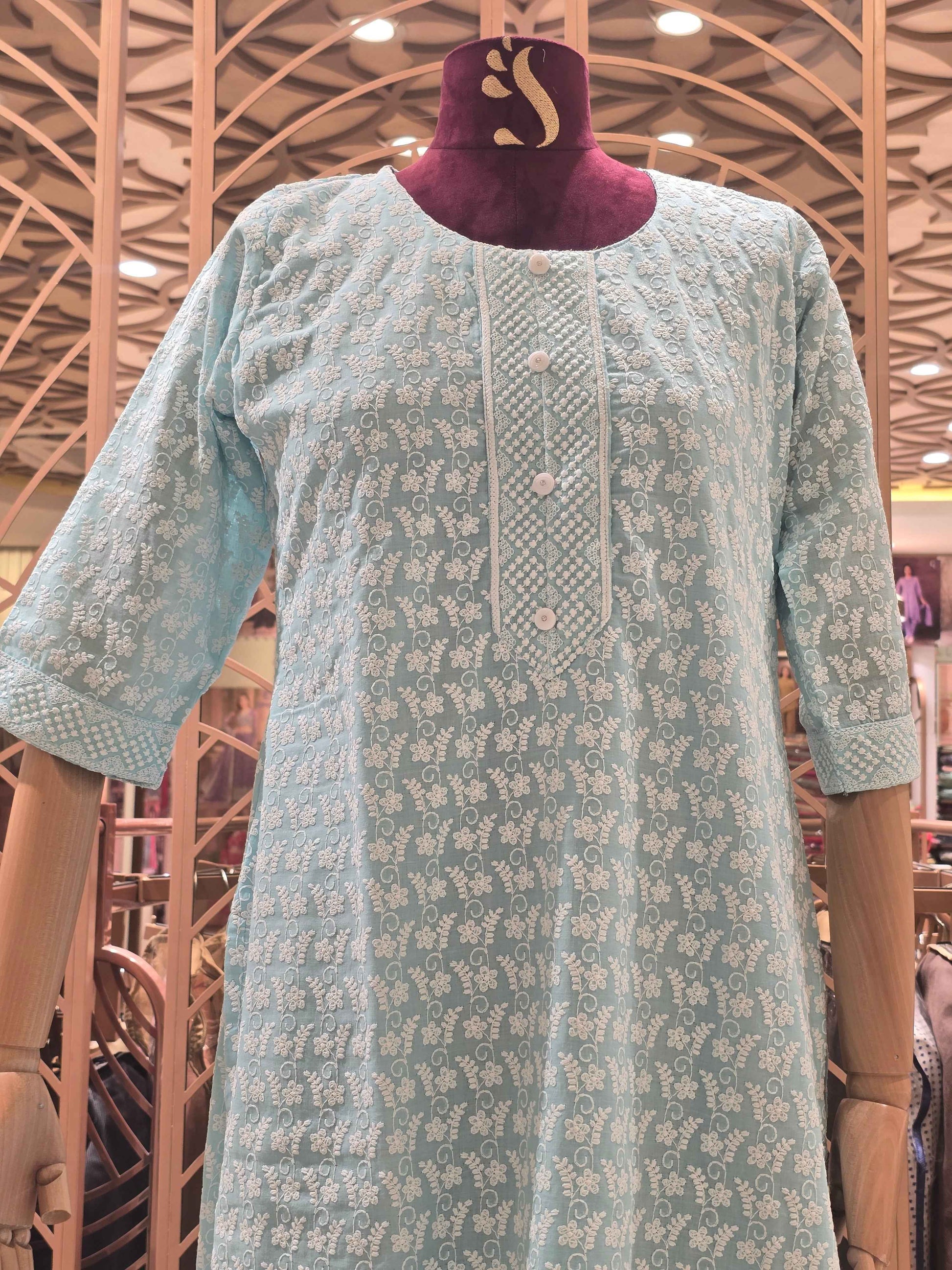 Cotton material blue color with white embroidery work over the body