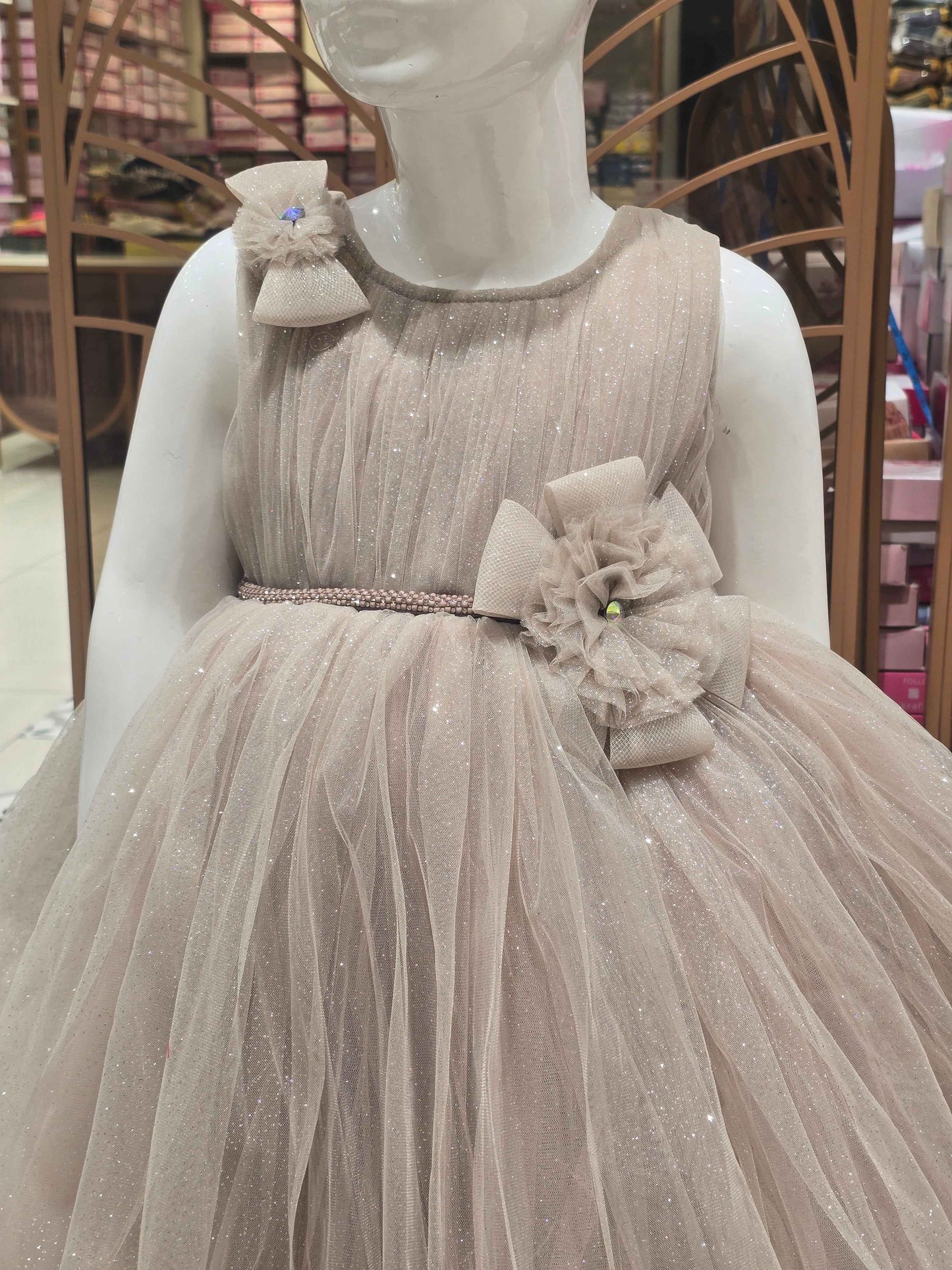 Shimmer Knitted material fawn colour party wear frock with two bow round neck