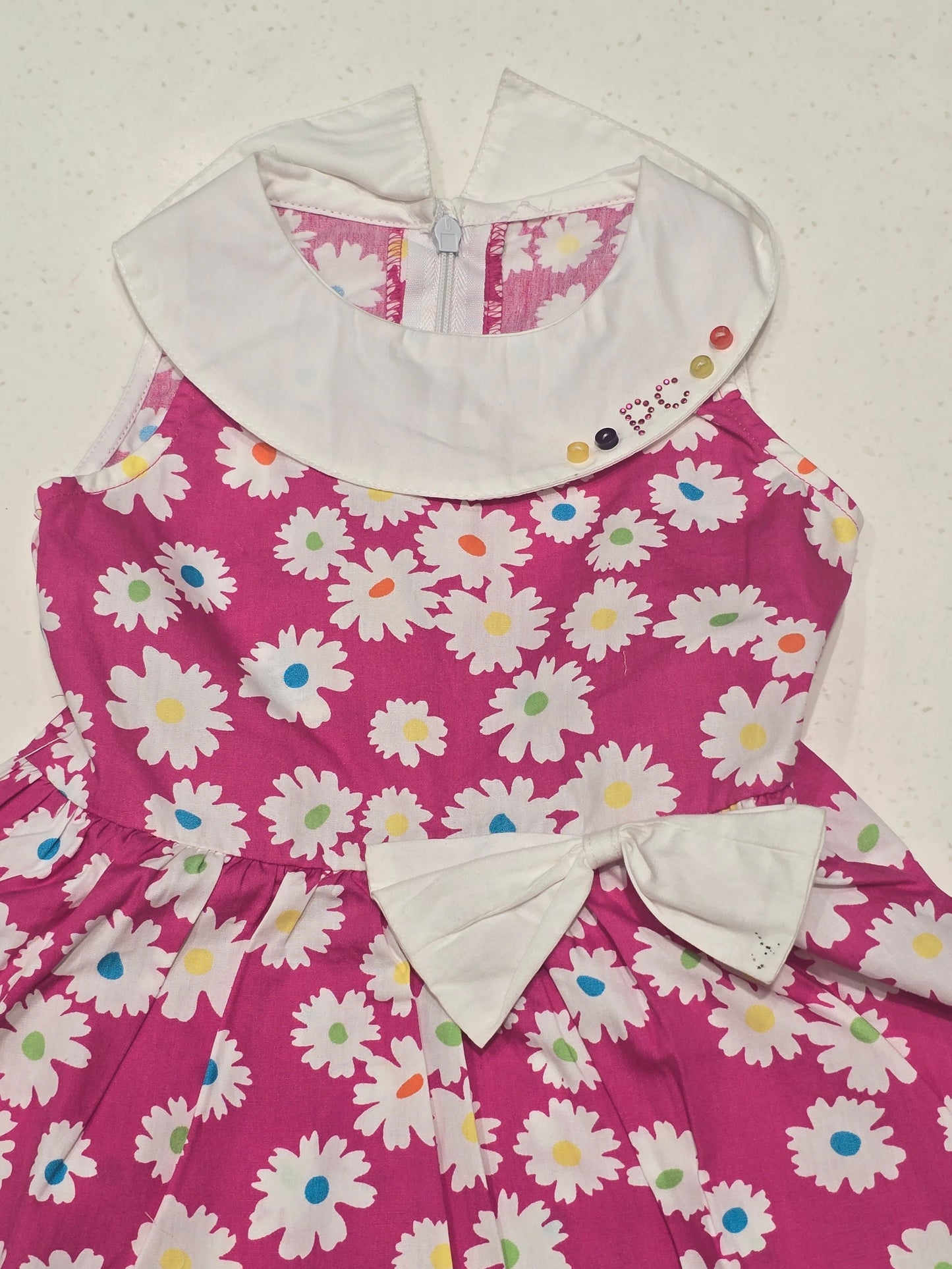 Printed Cotton material baby frock with flower prints and white bow