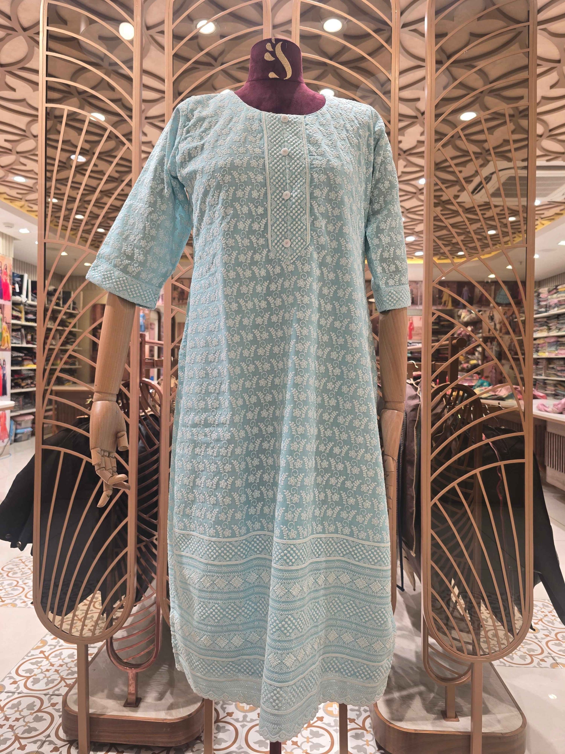 Cotton material blue color with white embroidery work over the body